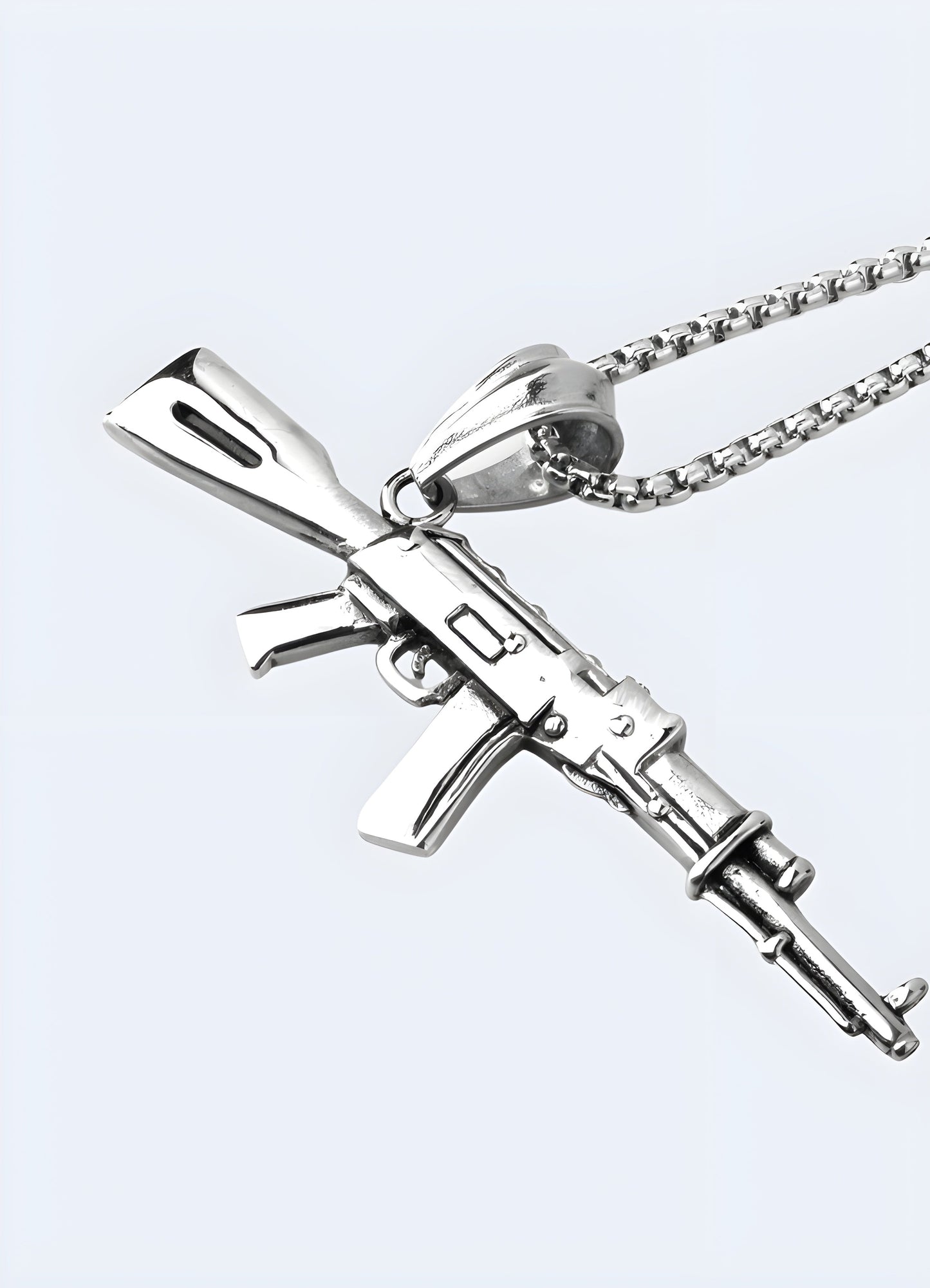 Silver AK-47 necklace displayed from the front side view, featuring a detailed pendant in the shape of the iconic firearm.