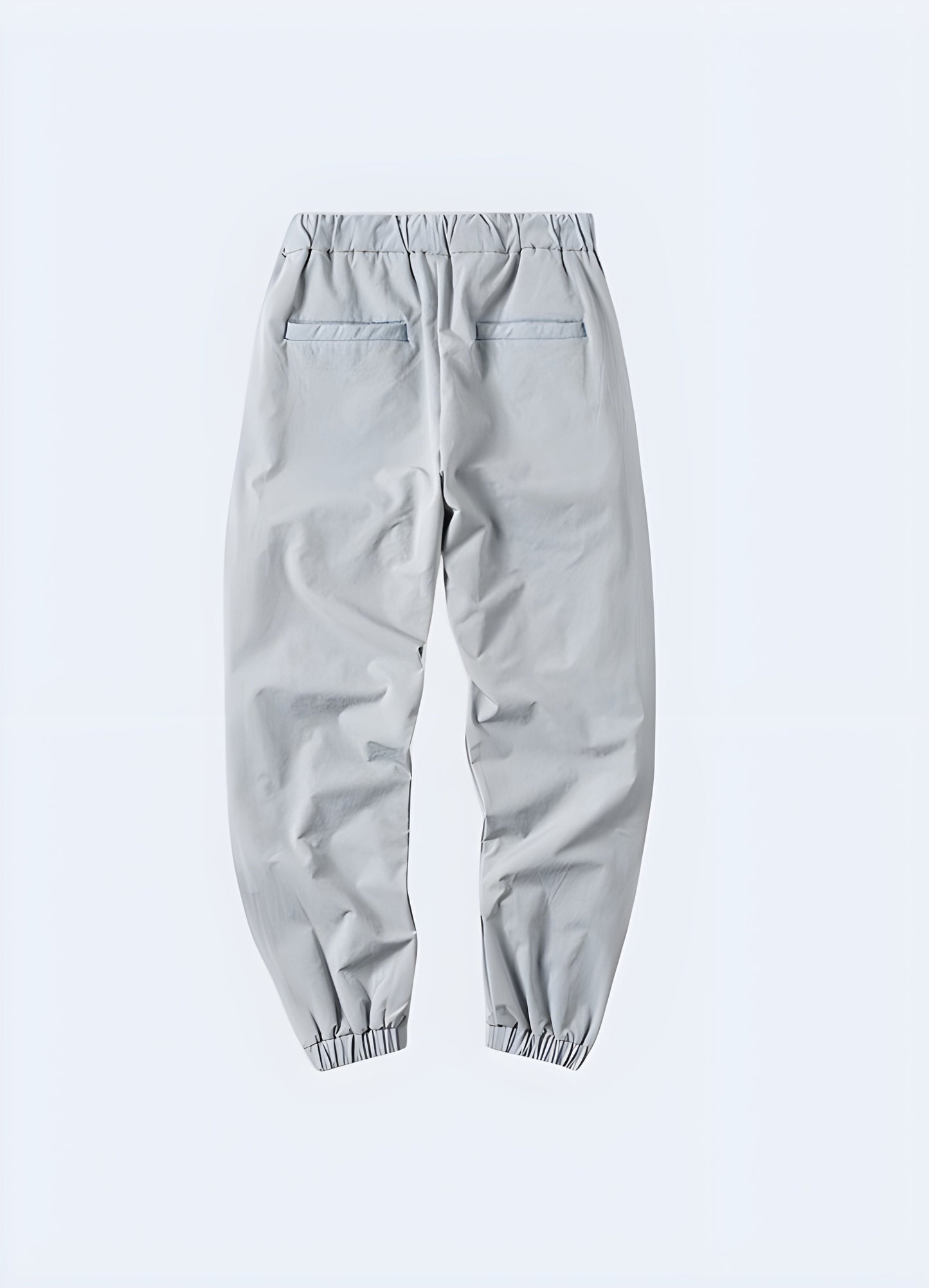 Gray avant-garde cargo pants with unique and stylish design details, showcased from the back side view, perfect for men in the Canaada looking to make a fashion statement.