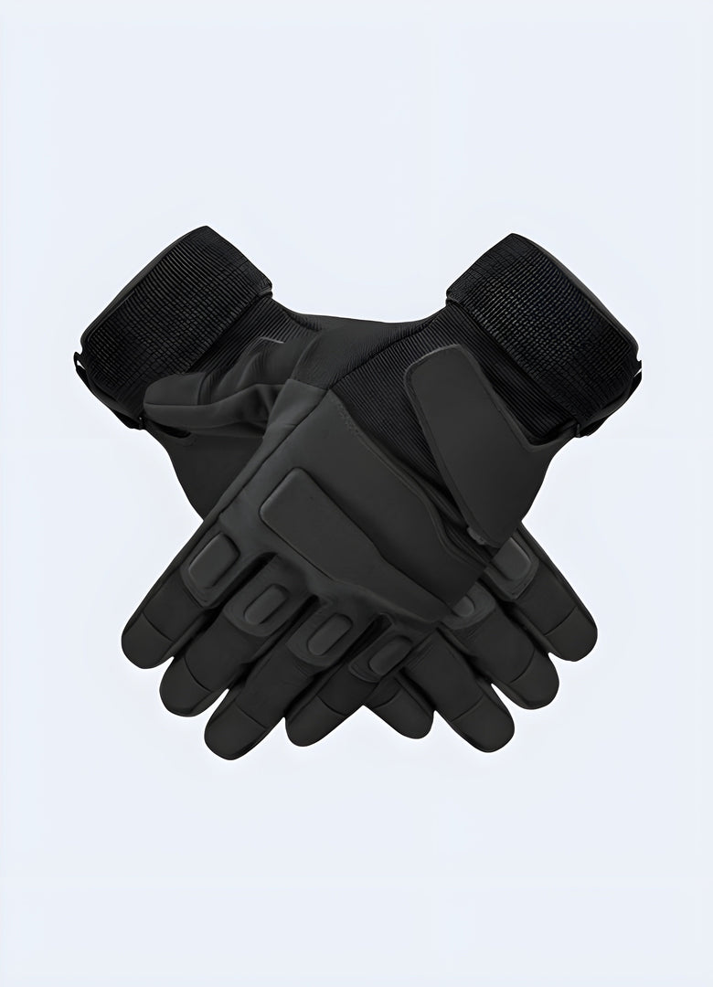 Black tactical gloves, side view, highlighting the adjustable wrist strap and durable stitching along the fingers Canada.