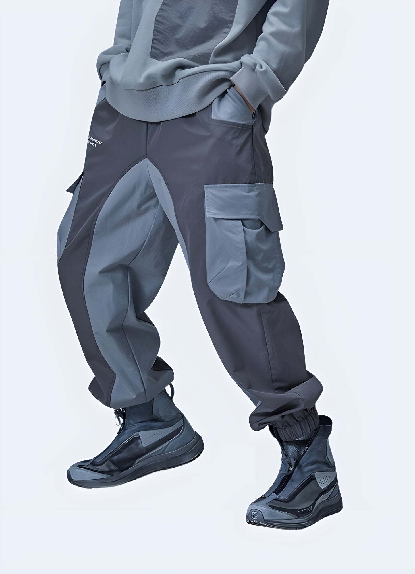 Side view of a man wearing stylish gray cyberpunk sweatpants, showcasing their unique design and relaxed fit, perfect for casual outfits in Canada.