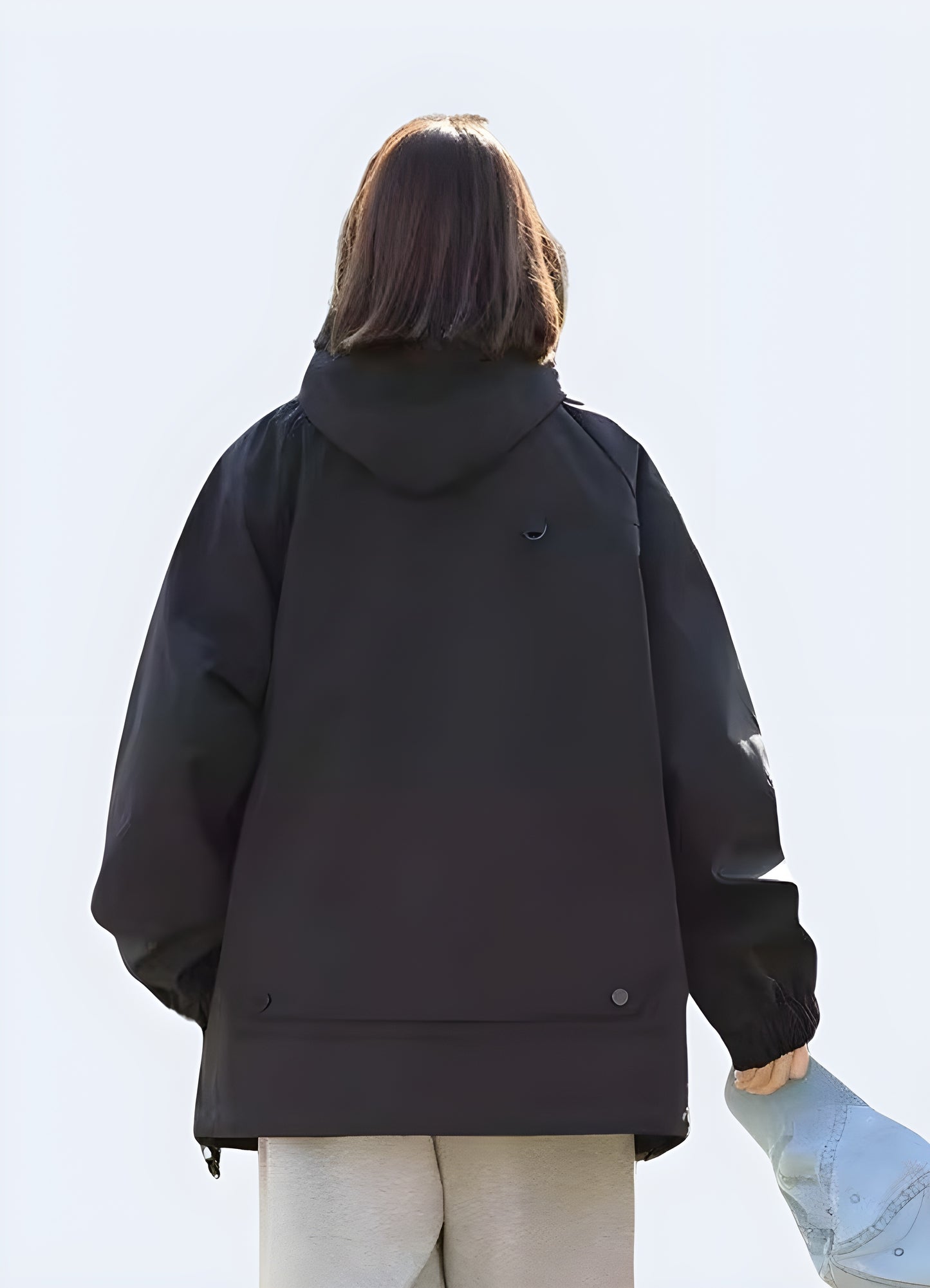 Back view of a hooded cargo jacket highlighting its practical design, spacious pockets, and versatile style, perfect for tackling Canada's urban adventures and everyday challenges.