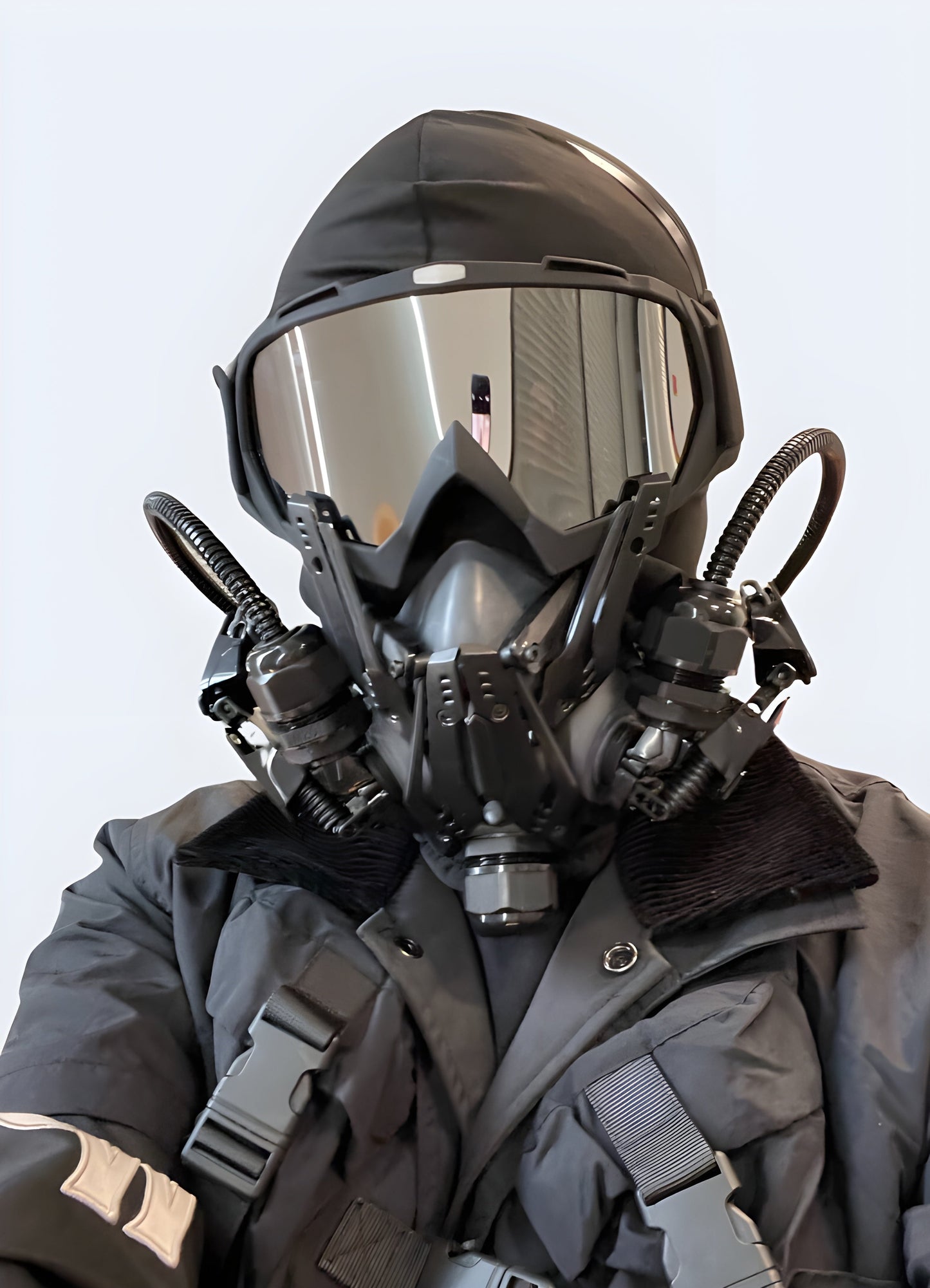 A front view of a man wearing an avant-garde mask, showcasing its unique and artistic design, available In Canada.