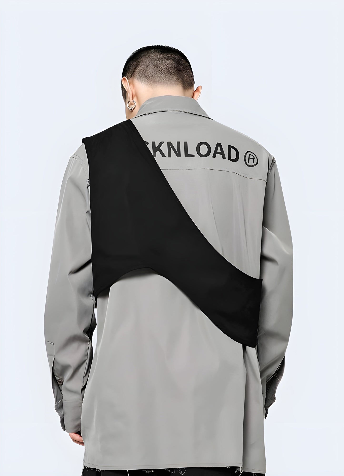 Rear view of a man donning a chic black half vest, highlighting the garment's attractive fit and design in the Canada market.