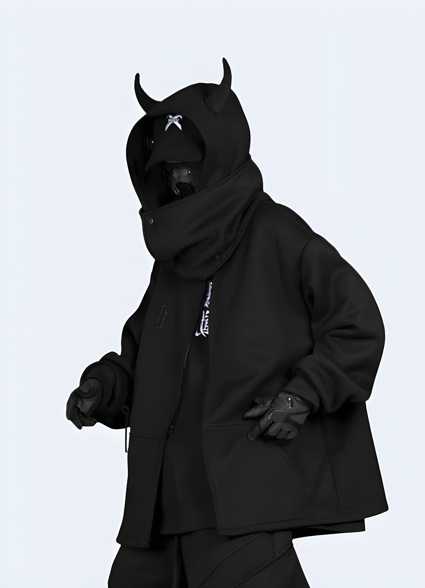 Side view of a man wearing an edgy black hoodie with horn accents, showcasing its distinctive design in the Canada.
