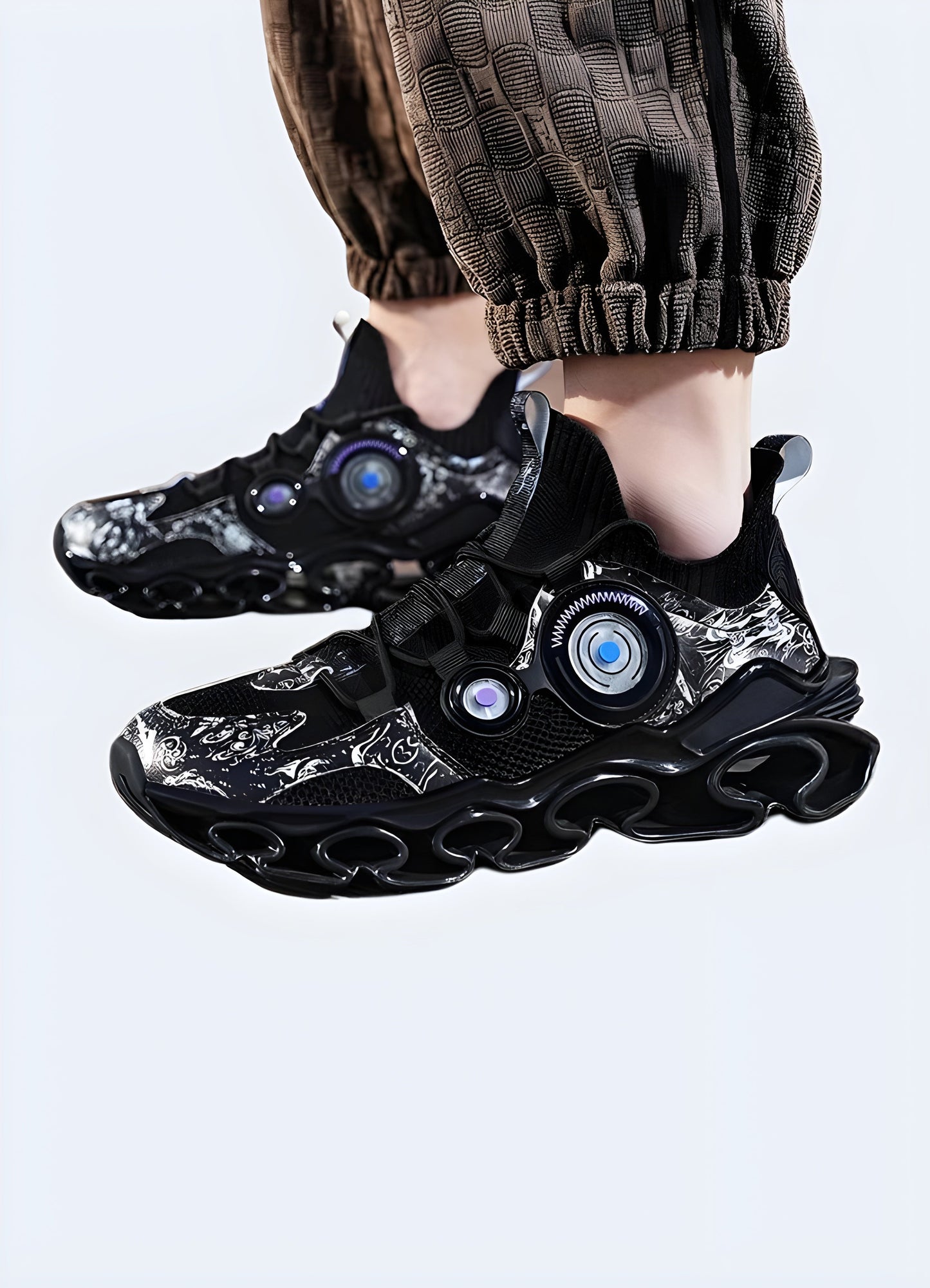Man wearing cutting-edge shoes while standing on a stone path, showcasing the shoes' functionality and style in an outdoor Canada setting, perfect for urban exploration and modern fashion.