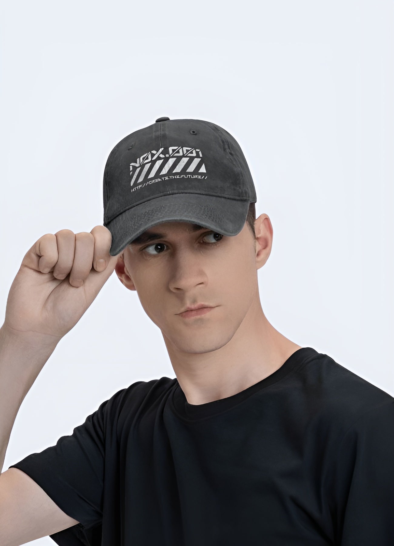 The black cap has a structured shape with a curved brim, fitting snugly on the woman's head.