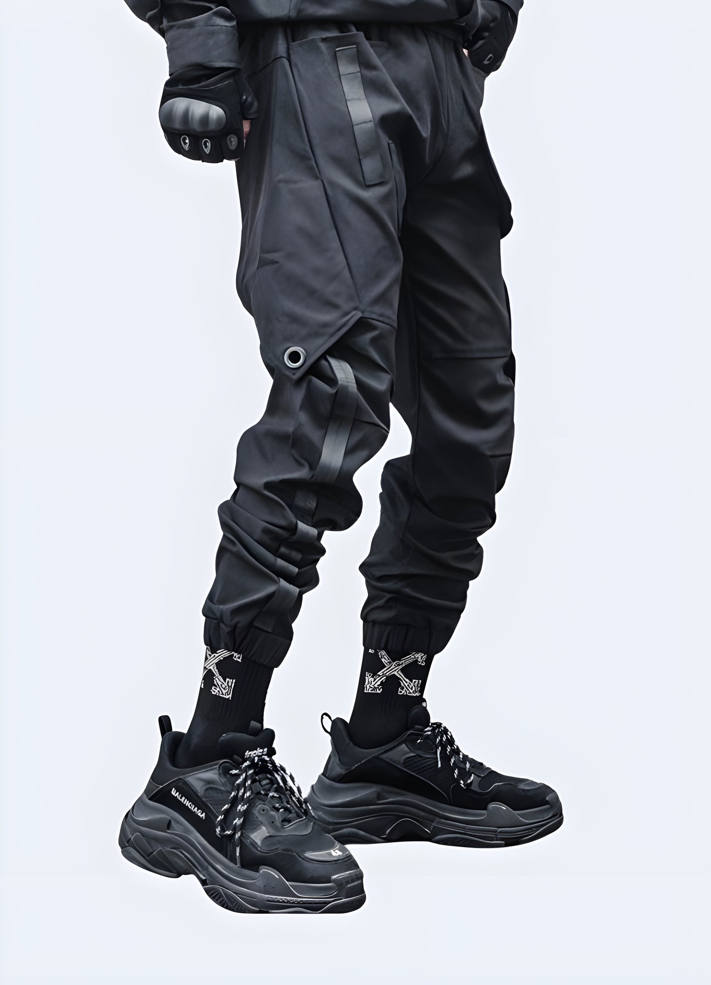 Man wearing cyberpunk pants, side view, futuristic techwear street fashion.