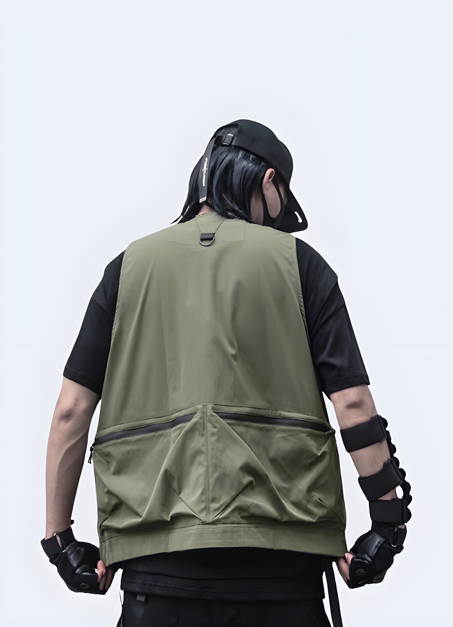 Rear view of a man wearing a groundbreaking black vest featuring built-in speakers and LED illumination, designed for outdoor use in the Canada.