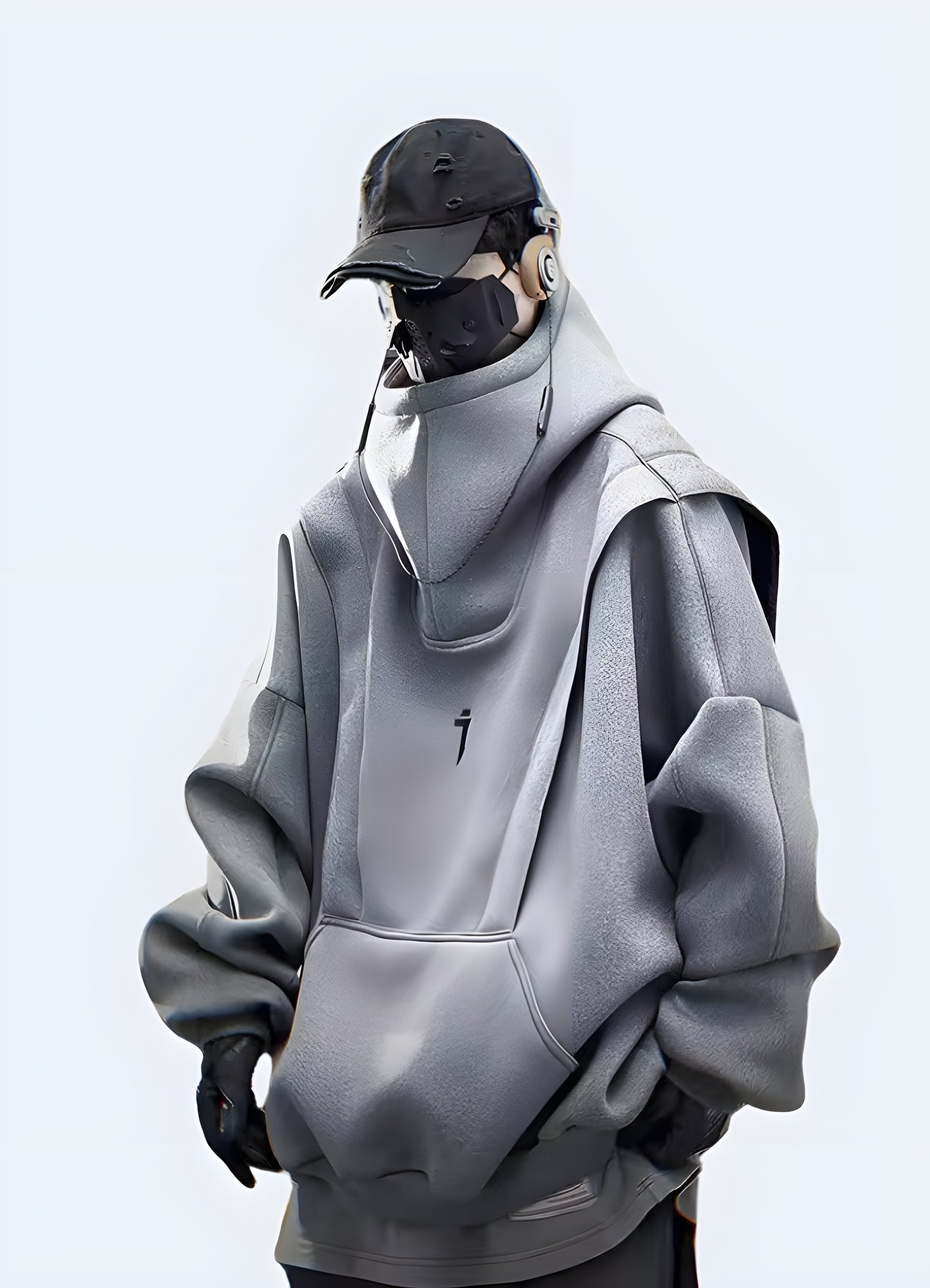 Man wearing a grey Harajuku-inspired hoodie with a mix of contrasting fabrics, multiple zippers, and an asymmetrical design, creating a striking and trendy streetwear outfit.