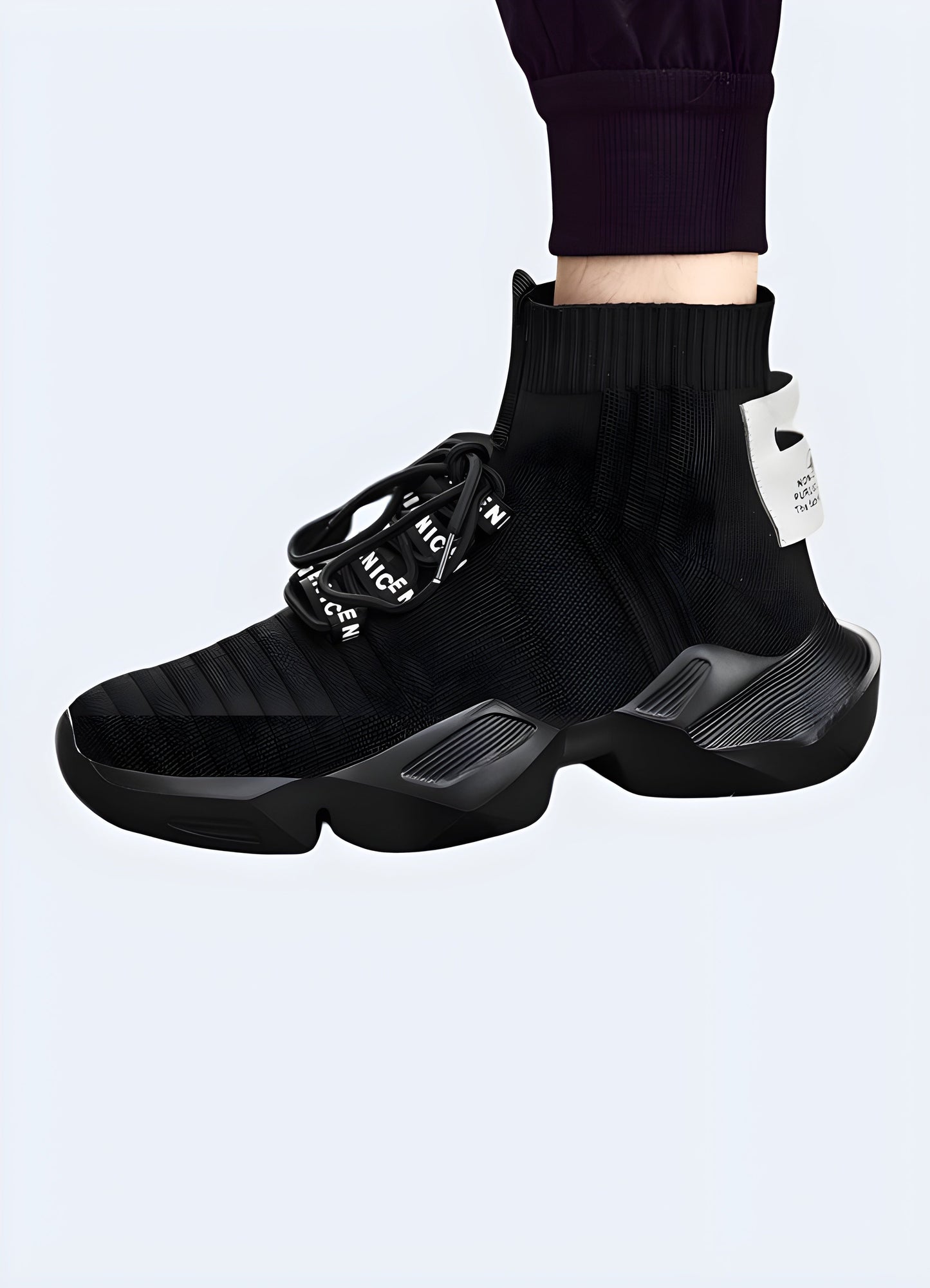 Side view of a man wearing lightweight black techwear sneakers, exemplifying the fusion of fashion and functionality sought after by Canada buyers.