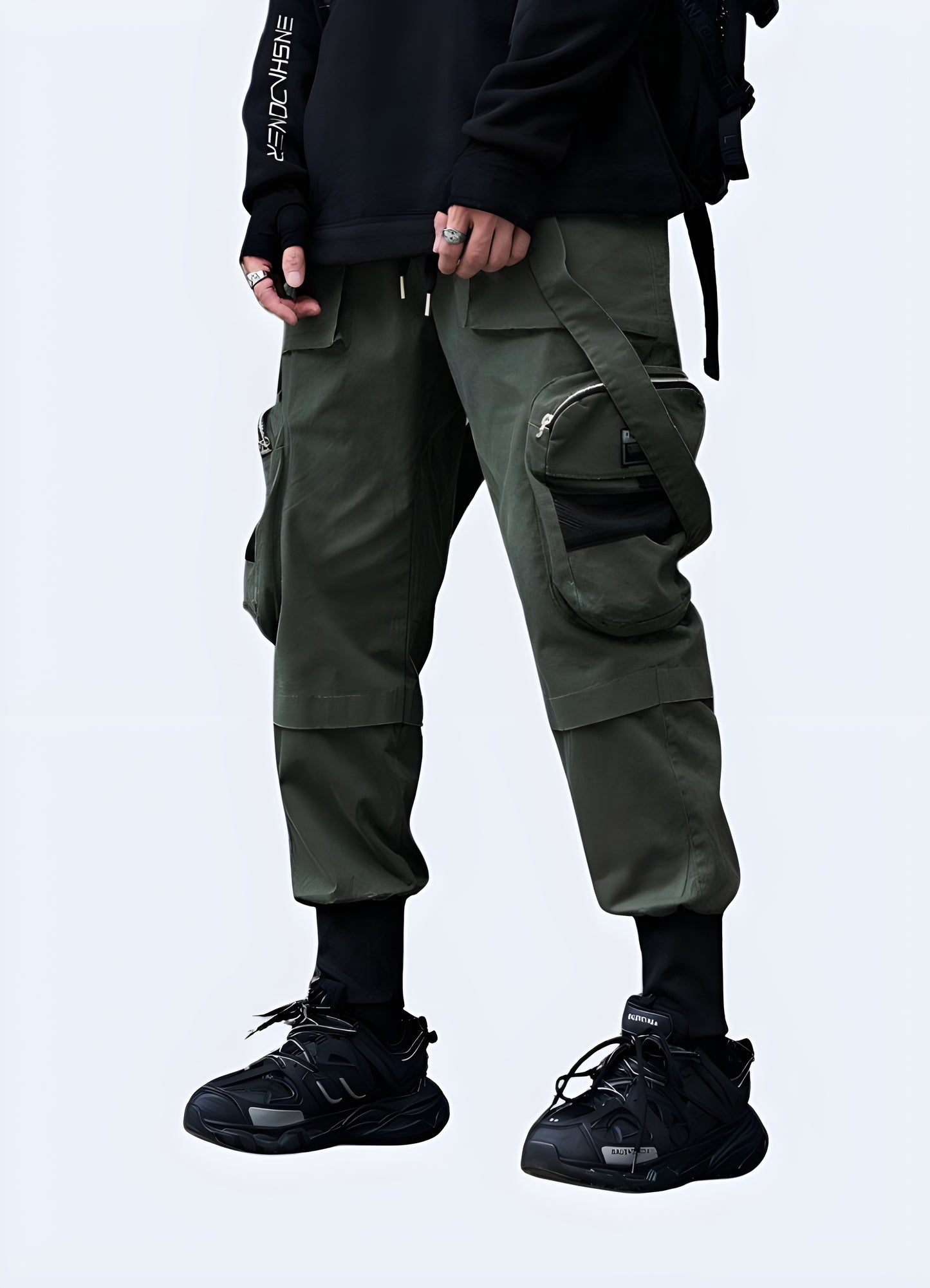 Front-side view of a man donning stylish techwear cropped pants, highlighting their contemporary fit and technical features, perfect for fashion-forward consumers in Canada.