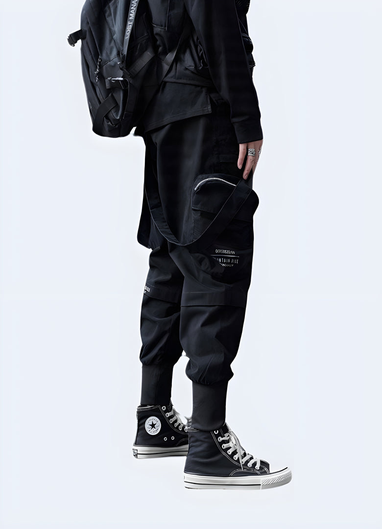 Side view of a man wearing versatile techwear cropped pants, showcasing their modern silhouette and practical design for active individuals in Canada.