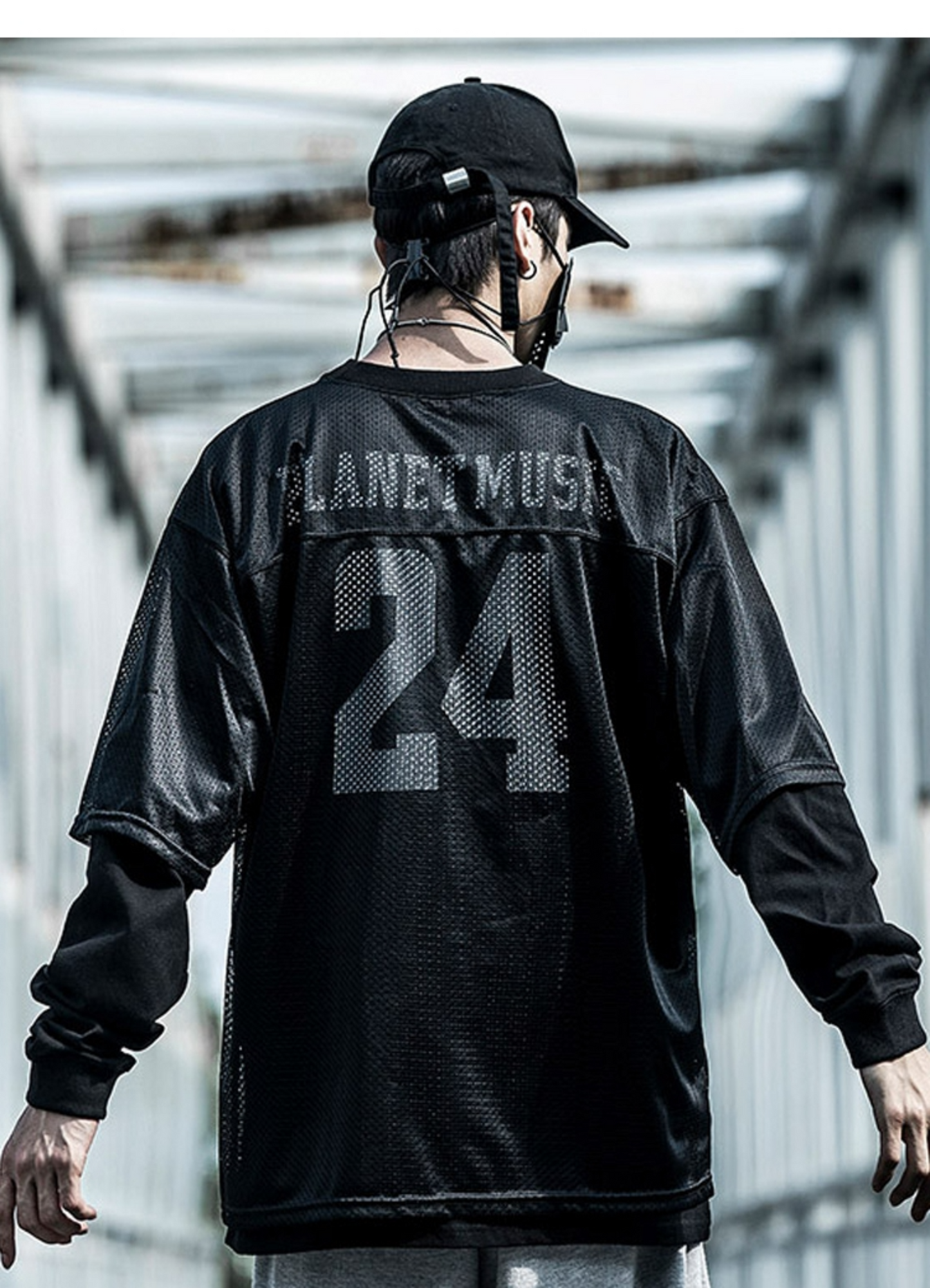 Man wearing techwear jersey, front view, showcasing the sleek design available in Canada.
