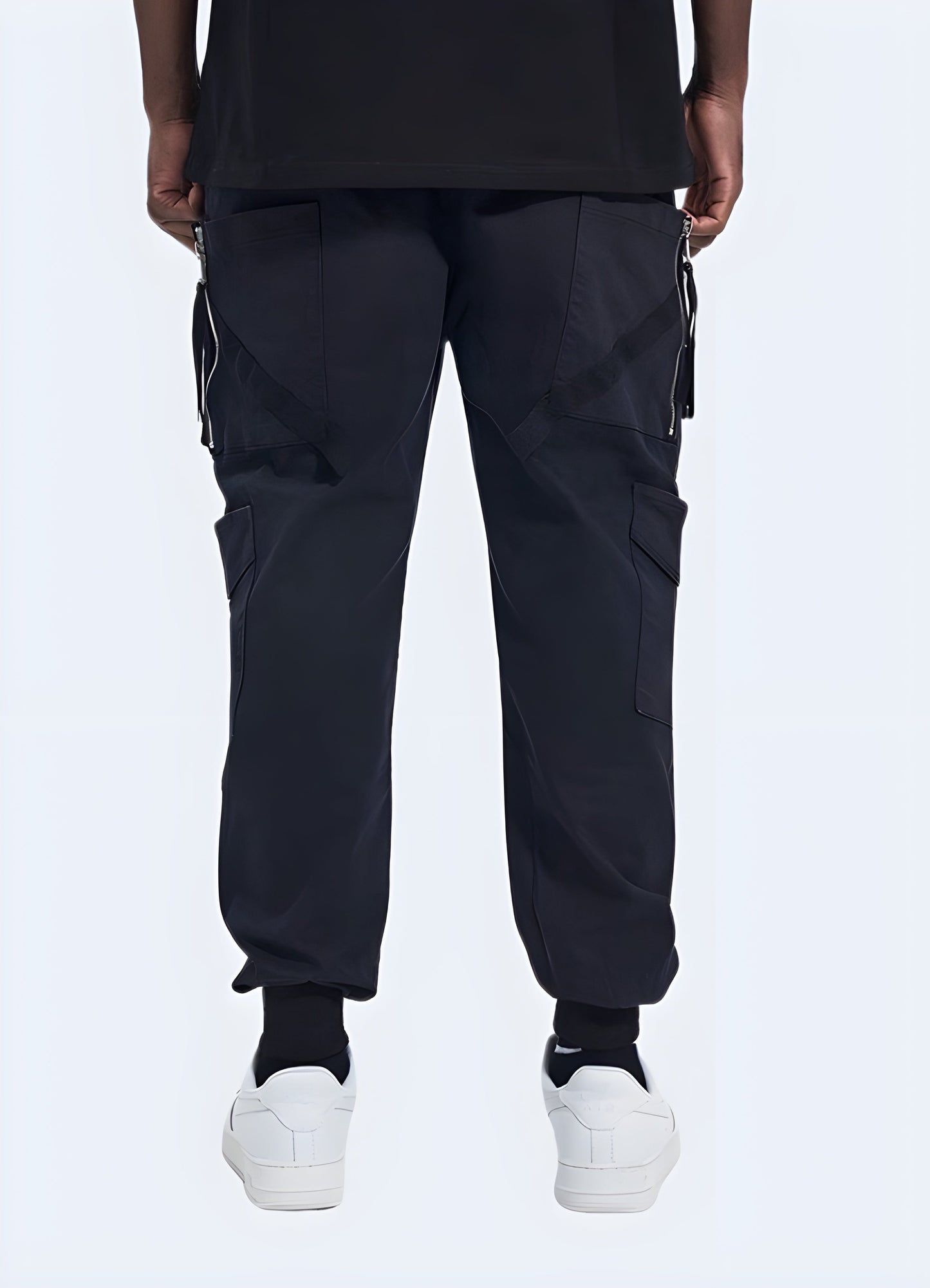 Back side view of a man wearing sturdy utility pants, emphasizing the garment's reinforced stitching and functional design, a must-have for Canada consumers seeking durability and style.