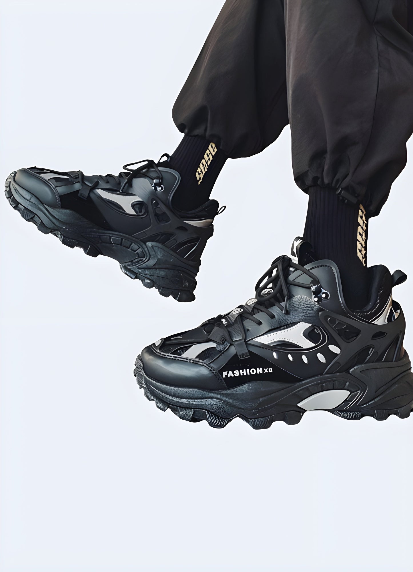 Fashionable male model showcasing trendy warcore boots in black leather with silver detailing, capturing the essence of alternative fashion popular among Canada consumers.