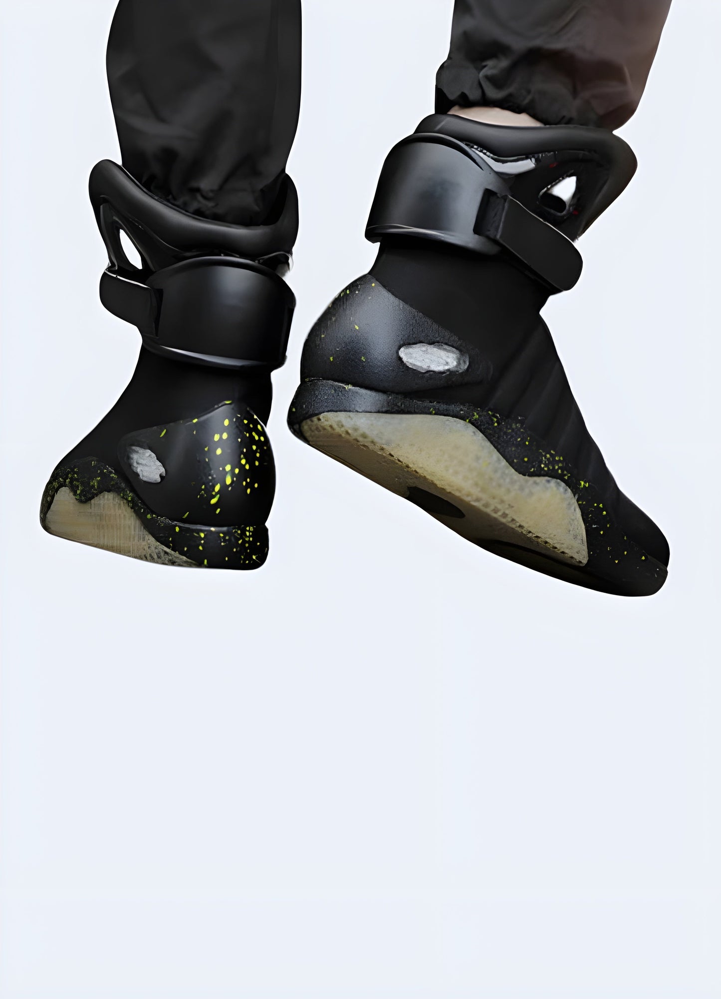 Men wearing high-top futuristic sneakers in black, back view in the Canada. Modern and stylish look.