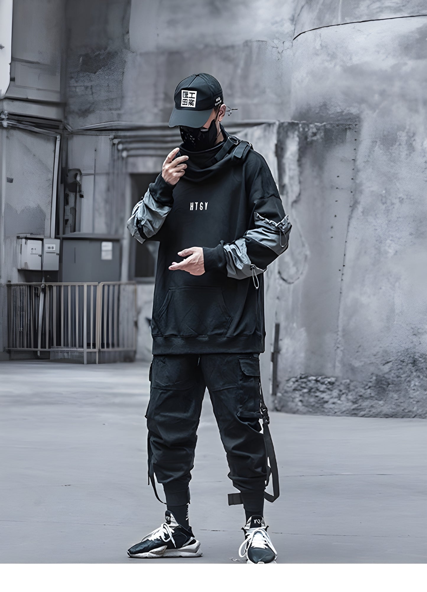 The hoodie is dark-colored with the text 'HTGY' prominently displayed on the front.