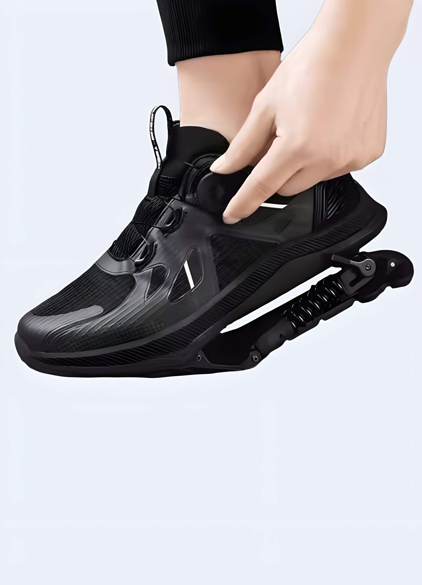 Side view of a man wearing mechanical-assisted black sneakers in the Canada.