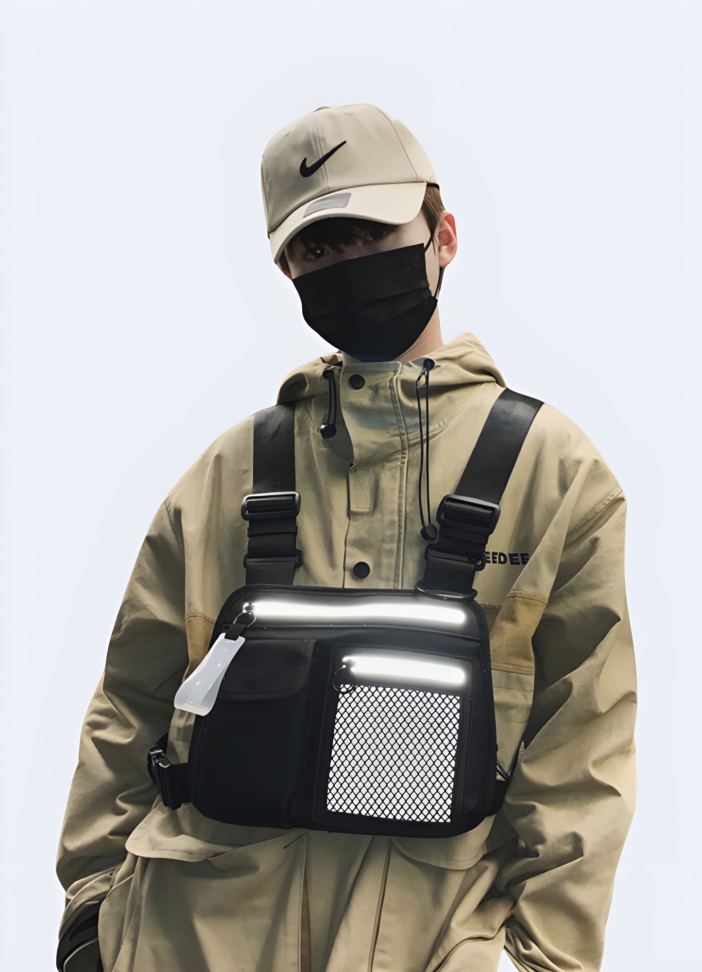 The front view highlights the rig’s multiple pockets and adjustable straps, emphasizing its stylish, functional appearance and how it fits across the man's chest Canada.