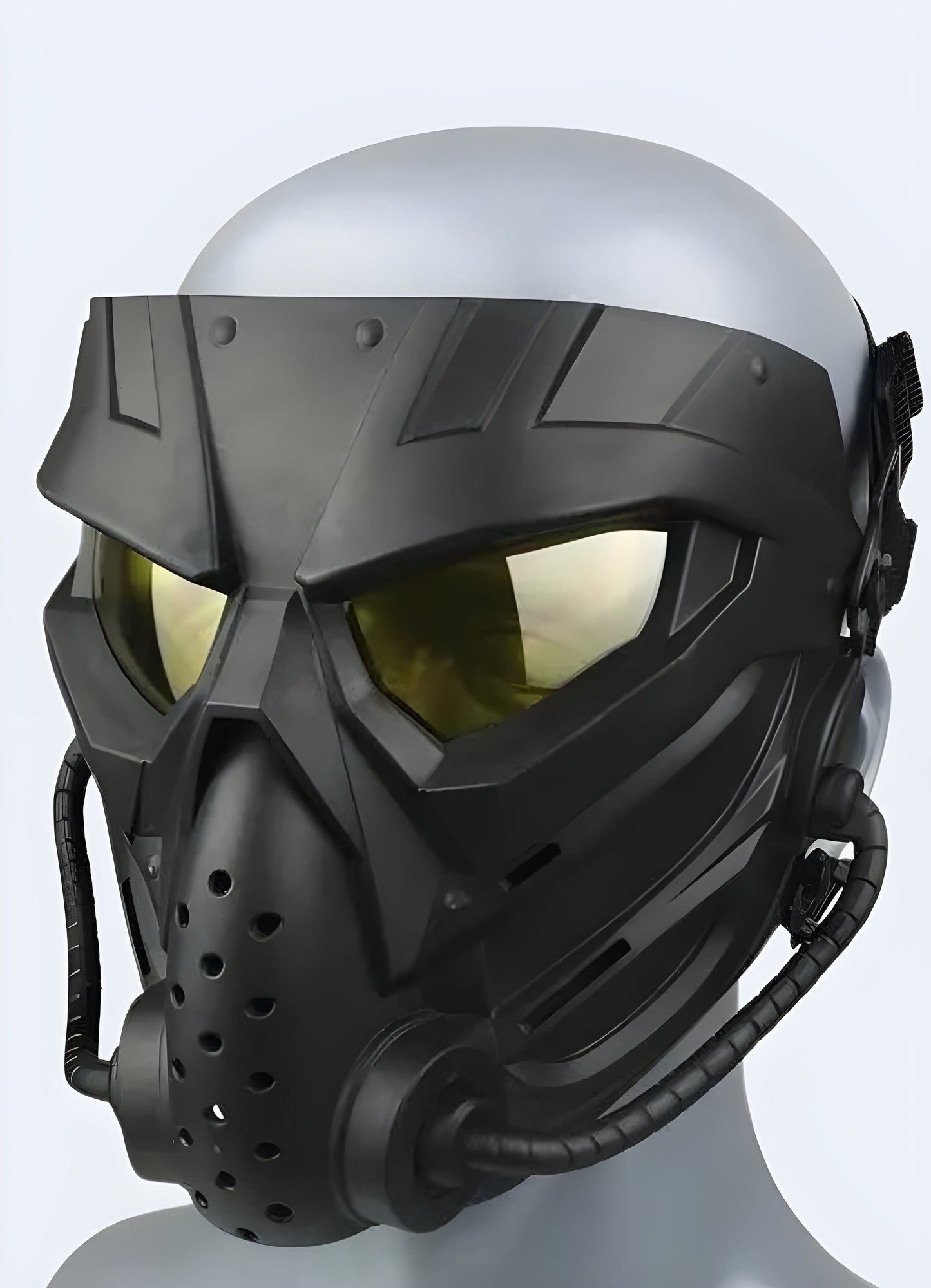 A side view of a model wearing a military tactical mask with gold eye detailing, highlighting its striking design, available in the Canada.