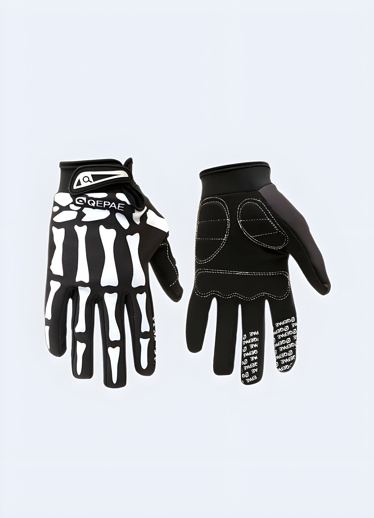A set of images showing black tactical gloves with a skull design from multiple angles.The side view showcases the gloves' contouring and fit and grip Canada.