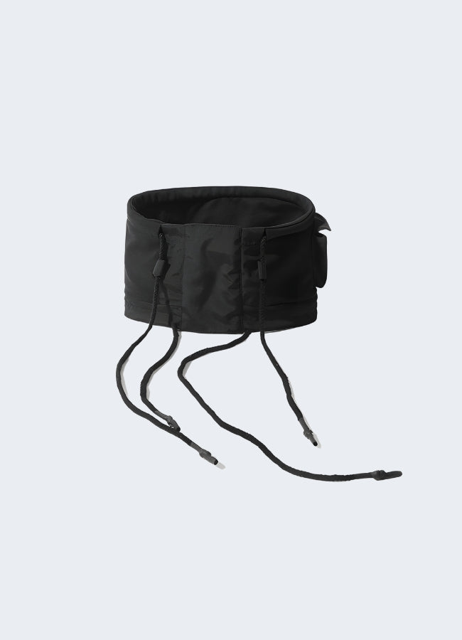 The design is sleek and minimalist, with a smooth, stretchy fabric that fits snugly around the model's neck. The overall look is functional and modern, typical of techwear fashion Canada.