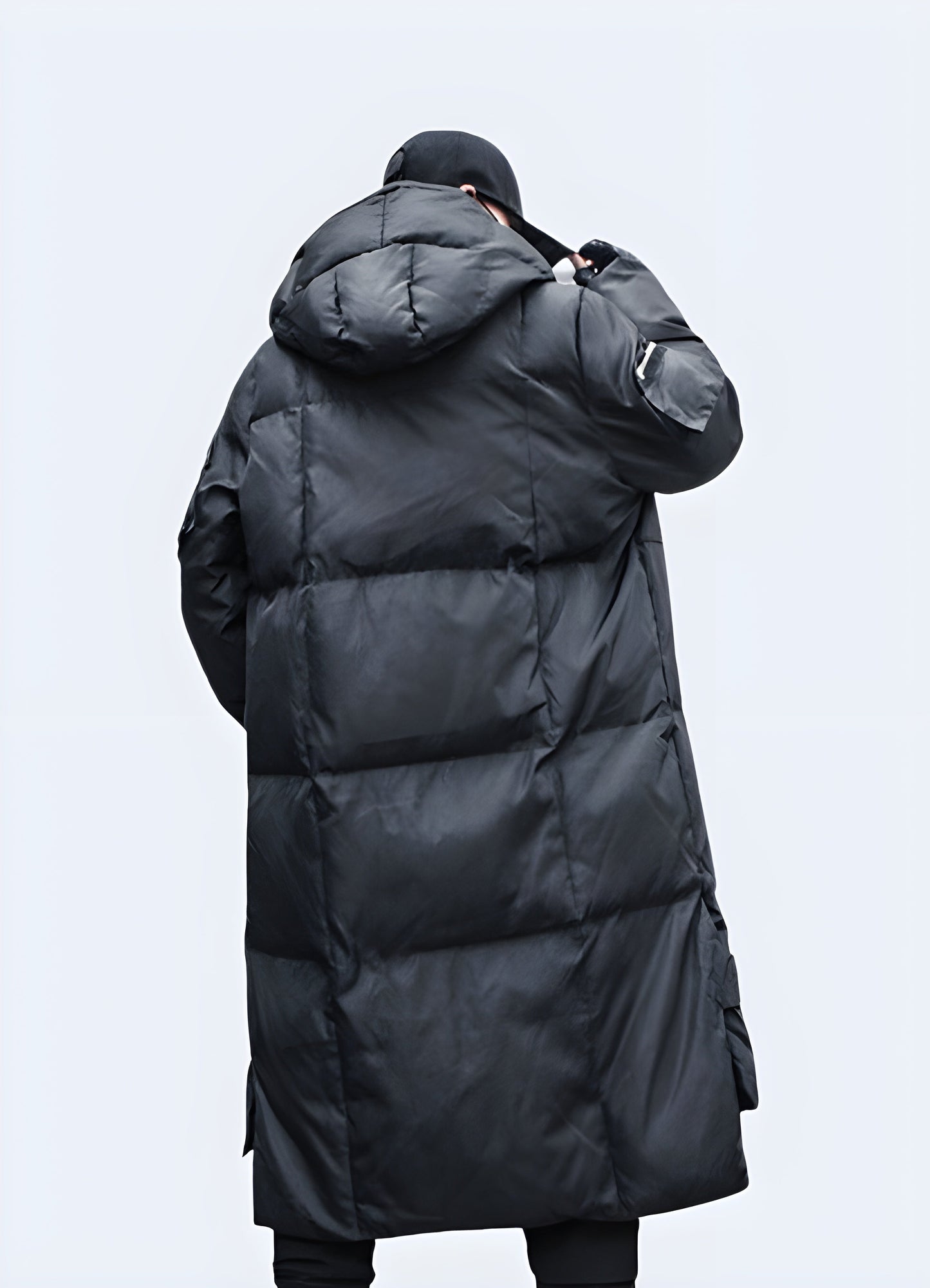 Back view of a cutting-edge techwear parka, showcasing its streamlined design and functional features, perfect for fashion-forward Canadians navigating cold city streets and outdoor adventures.