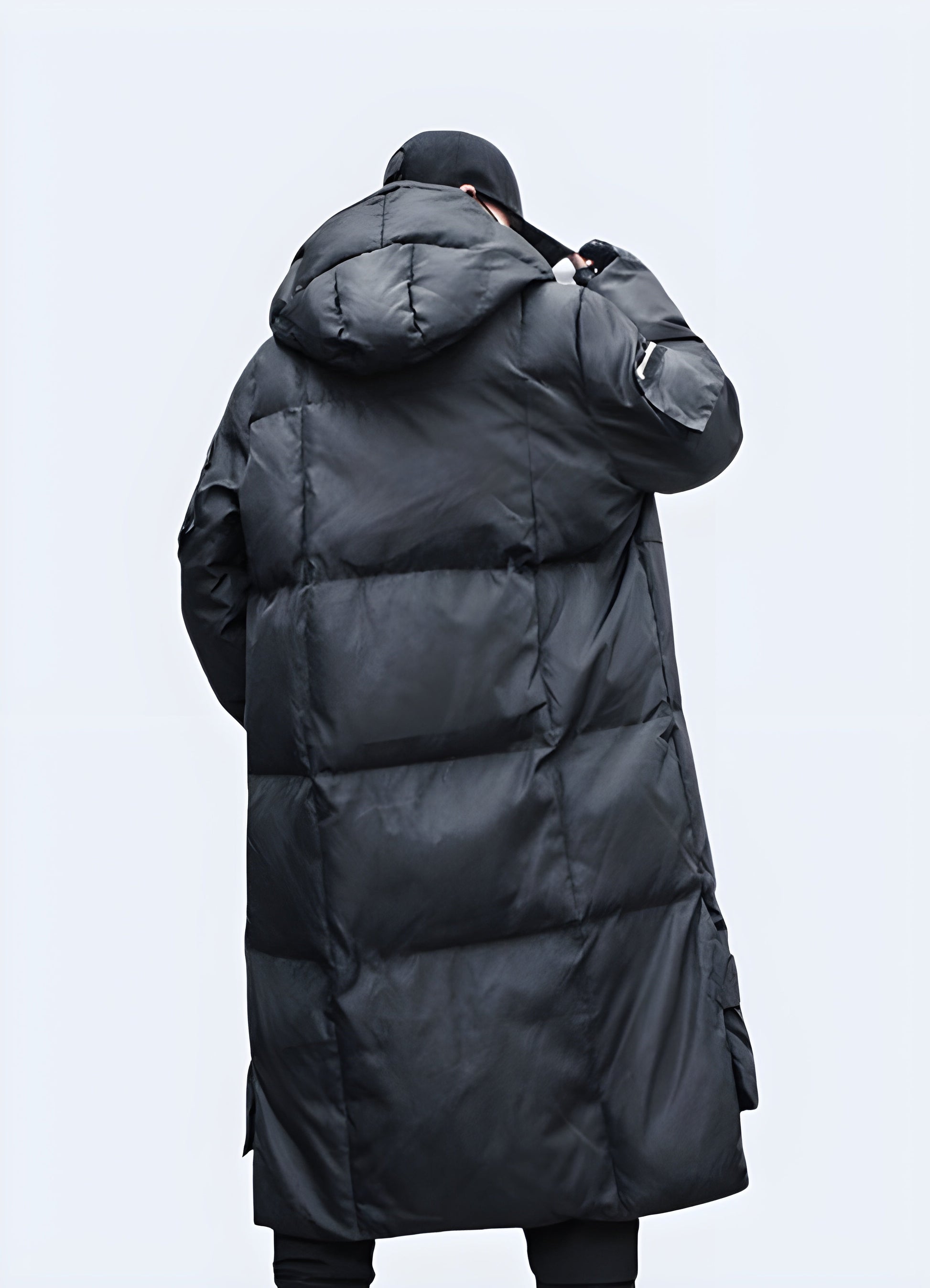 Back view of a cutting-edge techwear parka, showcasing its streamlined design and functional features, perfect for fashion-forward Canadians navigating cold city streets and outdoor adventures.