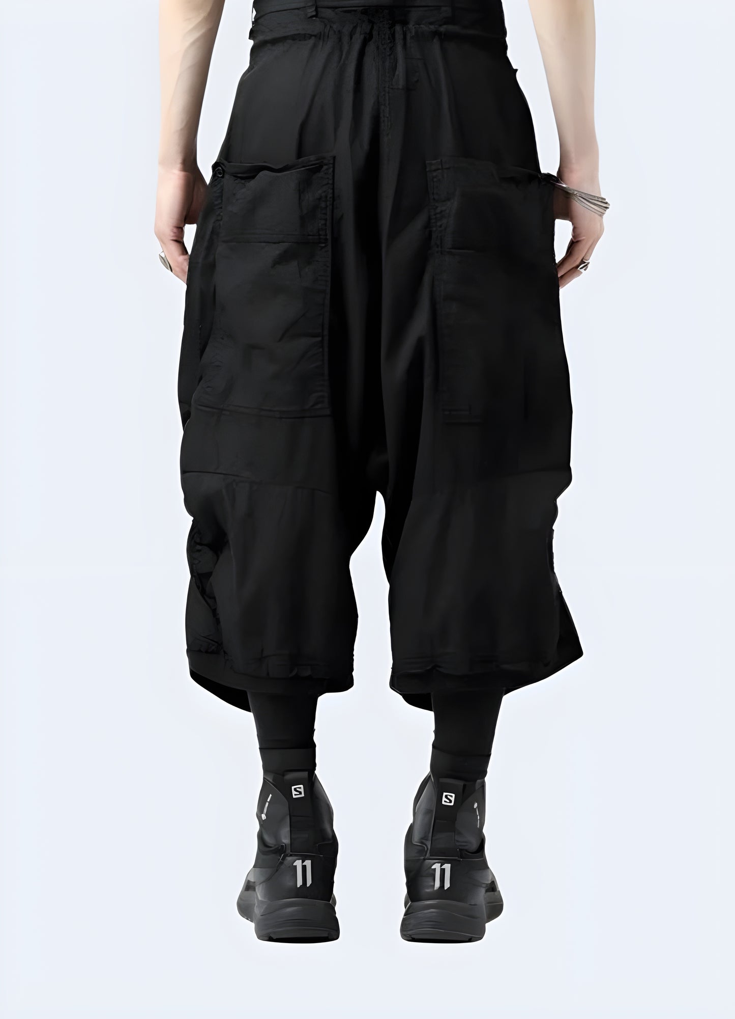Back view of high-quality waxed techwear Sarwell pants in black, showcasing their sleek design and functional features for fashion-forward individuals in Canada.