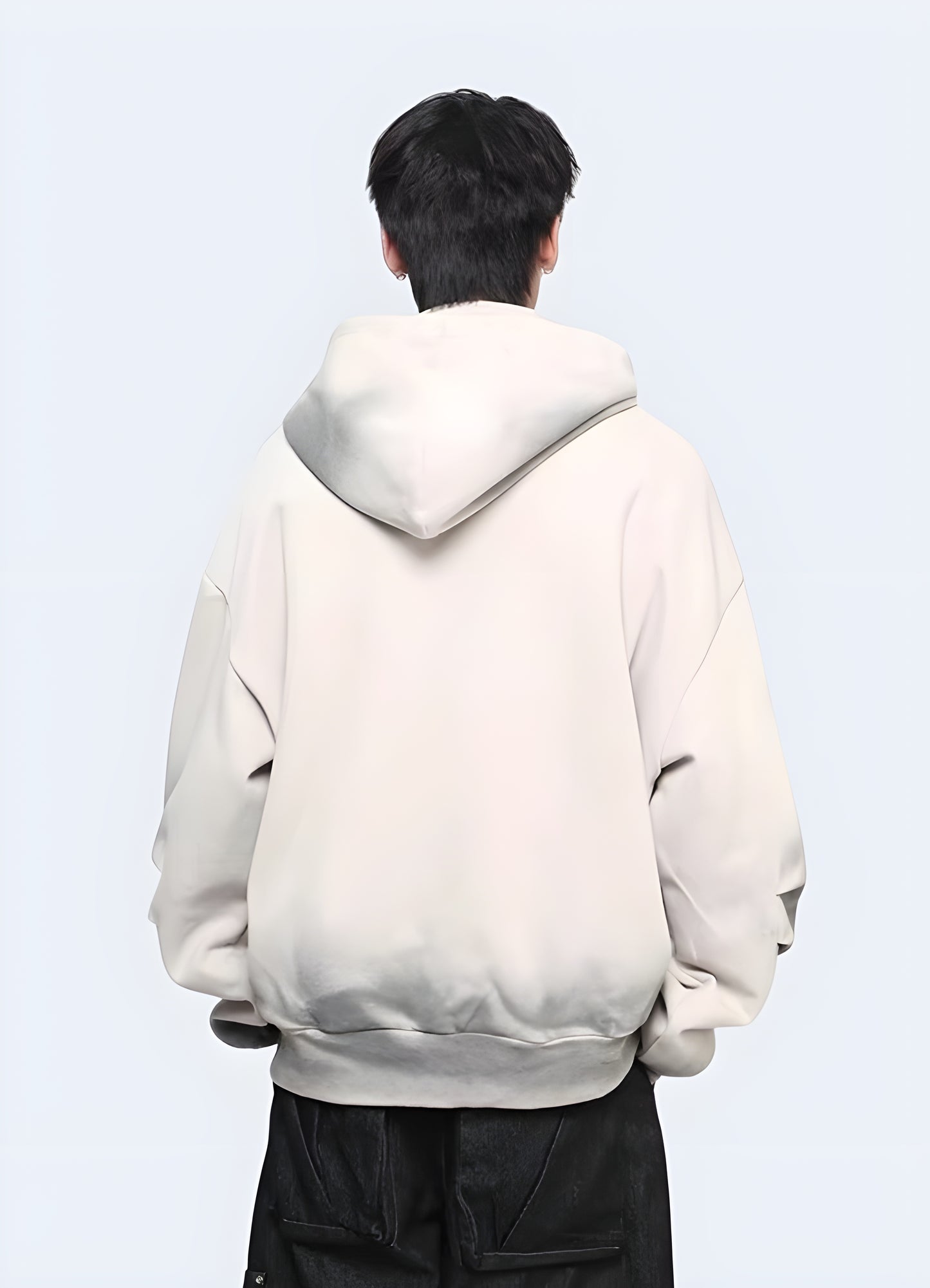 Man wearing grey tech fleece hoodie back view