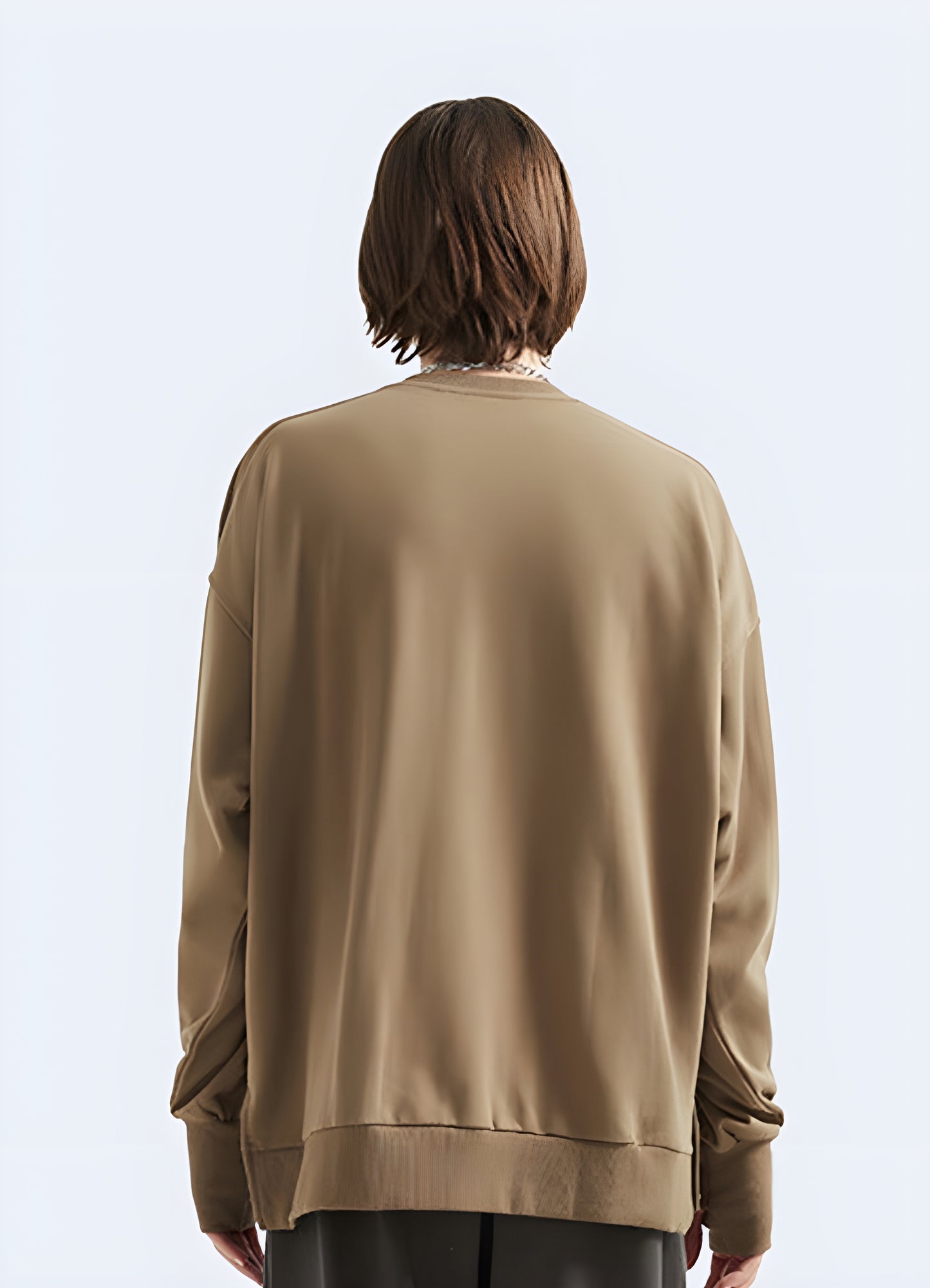 Woman wearing a brown pullover cotton techwear, back view, in Canada. Stylish and functional streetwear for urban environments.