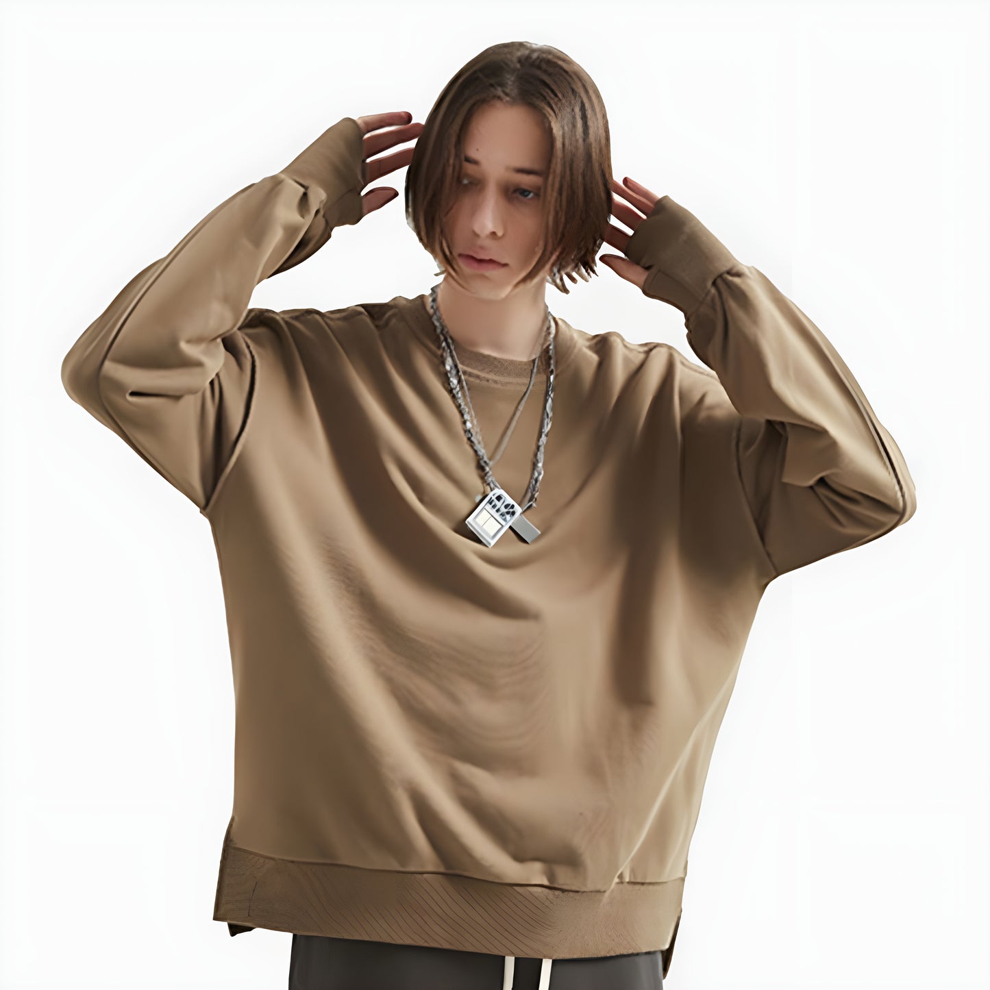 The sweatshirt features a minimalist, utilitarian design characteristic of techwear, with a simple, clean look Canada.