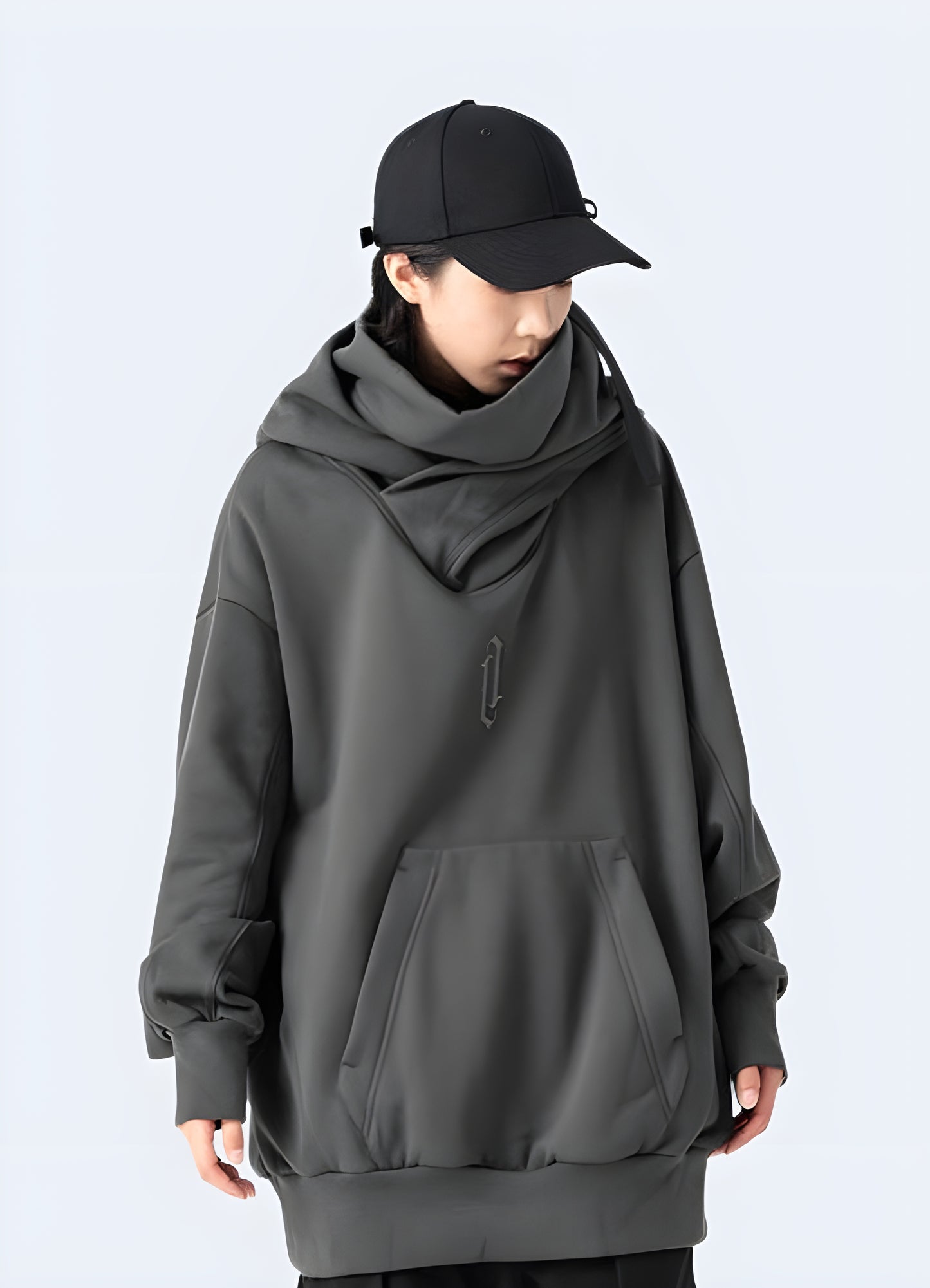 Woman wearing a grey comfortable Harajuku hoodie, front view, in Canada. Perfect blend of comfort and fashion.