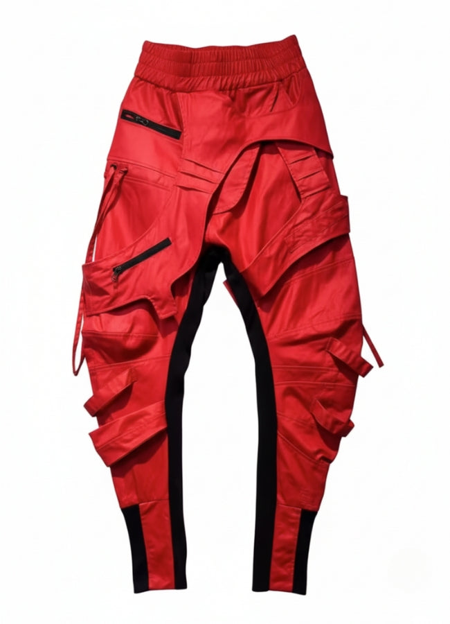 Red cyberpunk cargo pants with black stripe panels and multiple zip pockets, displayed on white background.