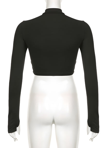 Back view of a woman in a classic black turtleneck bodysuit, showcasing its sleek design and flattering fit. This wardrobe staple is perfect for Canadian fashion enthusiasts who value timeless elegance and versatile style in their everyday outfits.