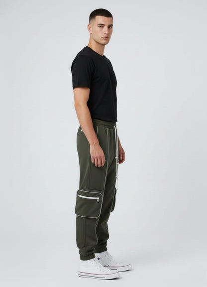 Side angle of olive green techwear cargo pants showcasing sleek white reflective, large pockets, and urban tapered silhouette.