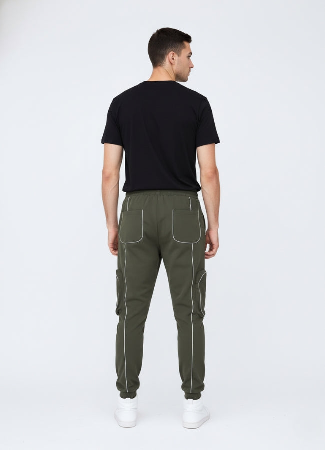 Rear view of olive green jogger-style techwear pants featuring contrast stitching, elastic cuffs, and minimalist back pocket design.
