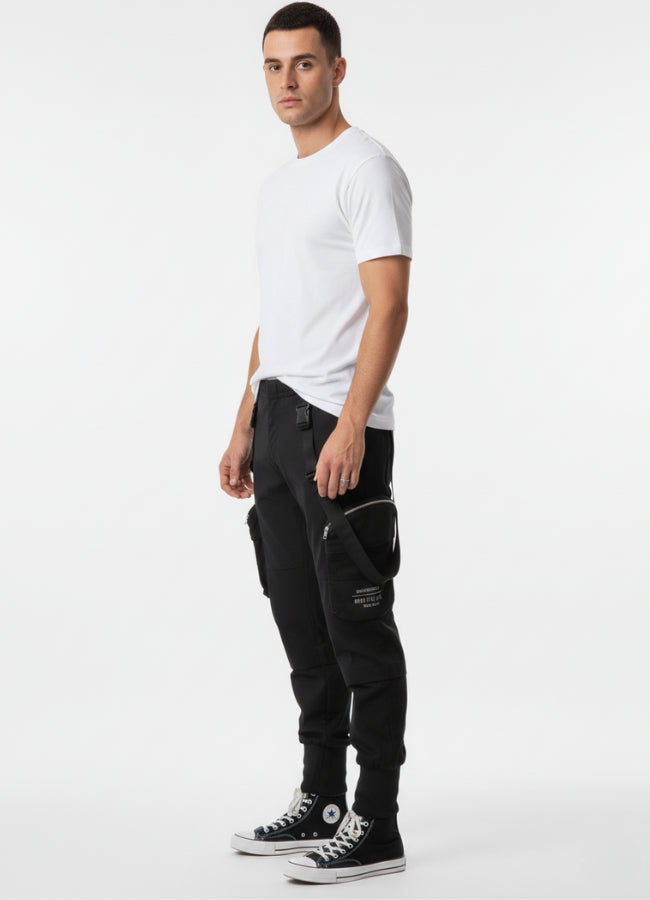 Side view of techwear cropped pants featuring straps, zip details, and modern techwear silhouette.