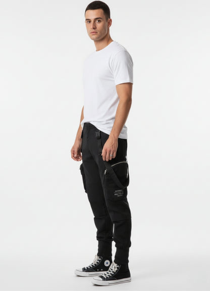 Side view of techwear cropped pants featuring straps, zip details, and modern techwear silhouette.