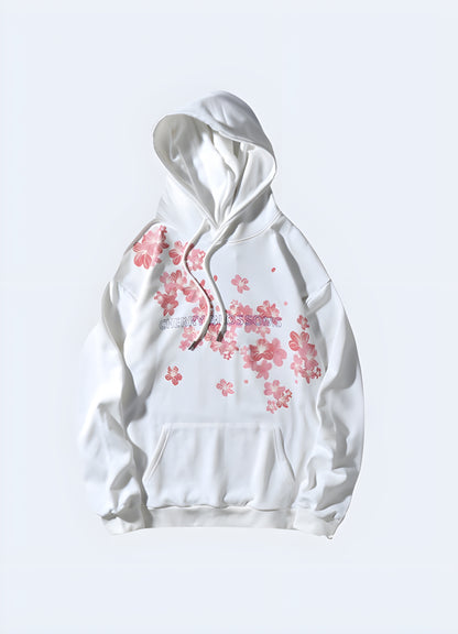 Woman wearing a women's Sakura Harajuku hoodie, white, front view, urban style in Canada.