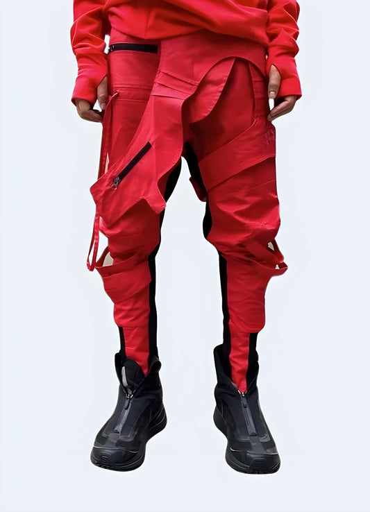 Unique asymmetric waxed red techwear pants, combining avant-garde style with functional design, available in Canada.