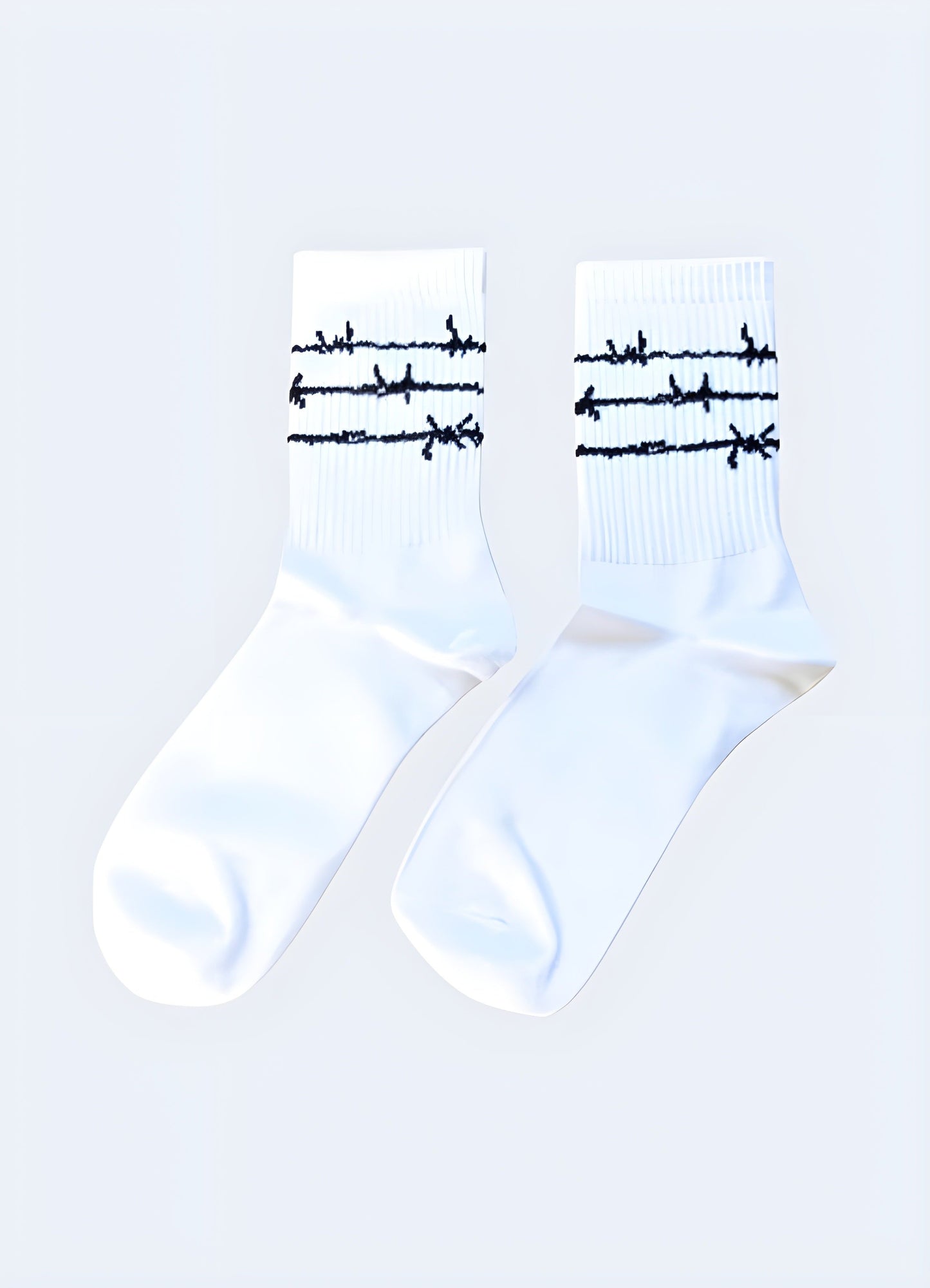 Eye-catching white socks showcasing a detailed barbed wire print, suitable for those seeking an unconventional fashion accessory.