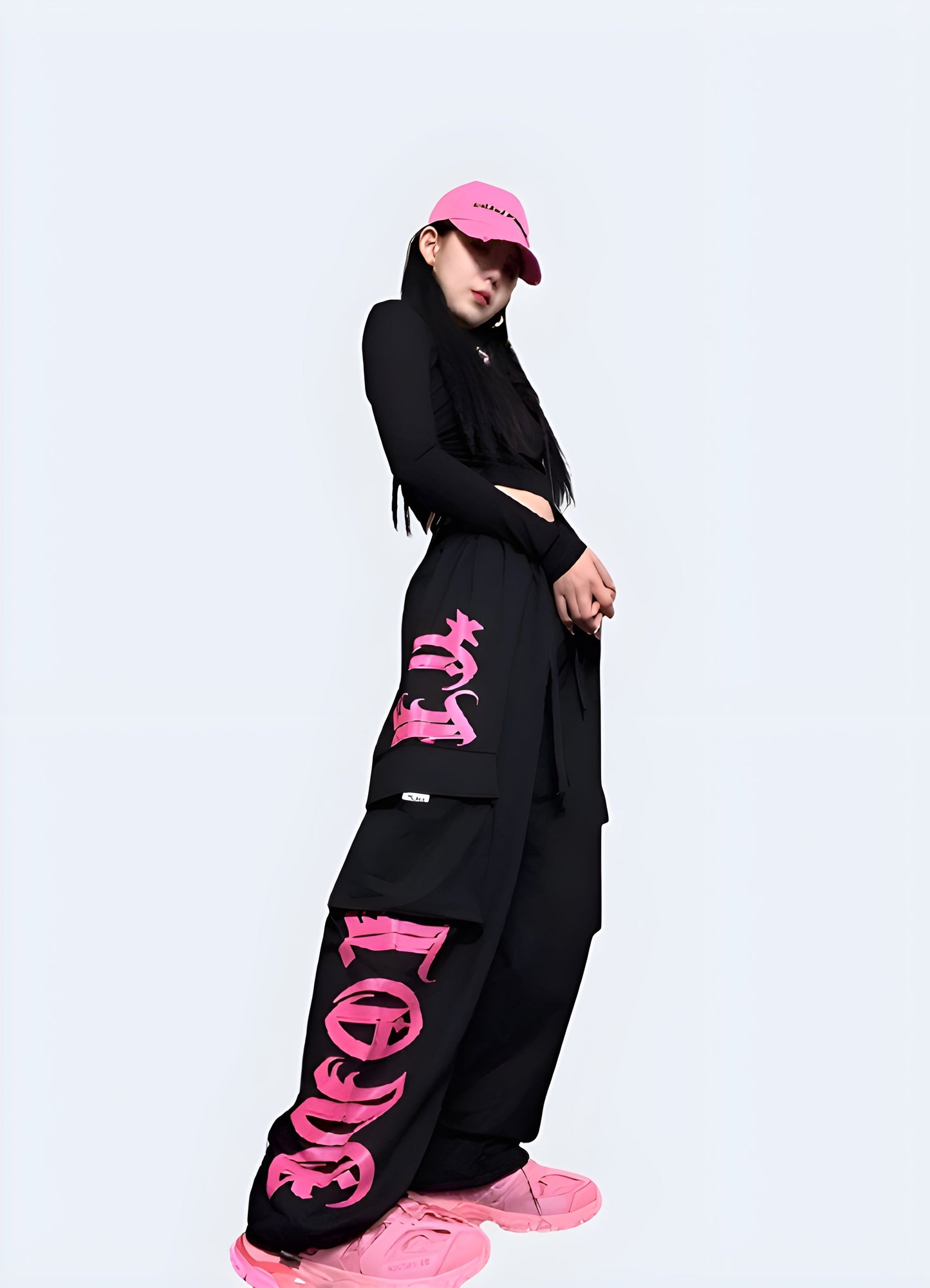 Right side view of a woman wearing black and pink techwear pants, highlighting the fashionable and functional style ideal for everyday wear in the Canada.