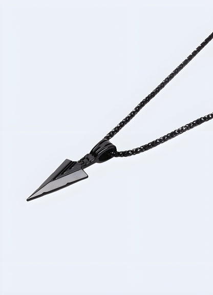 Side view of a black arrowhead necklace worn by a model in the Canada.