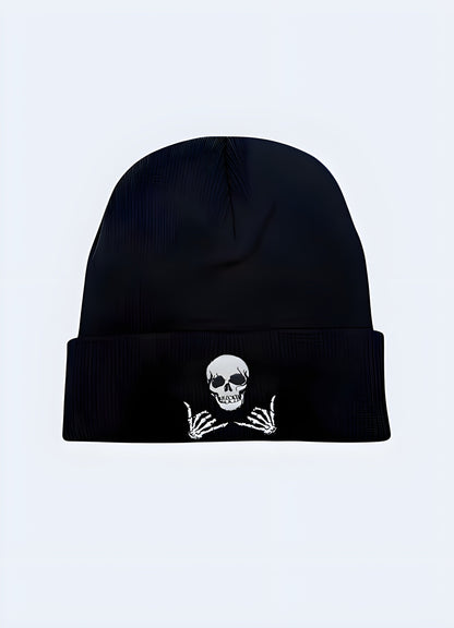 Front view of a black beanie featuring a prominent skull design Canada.