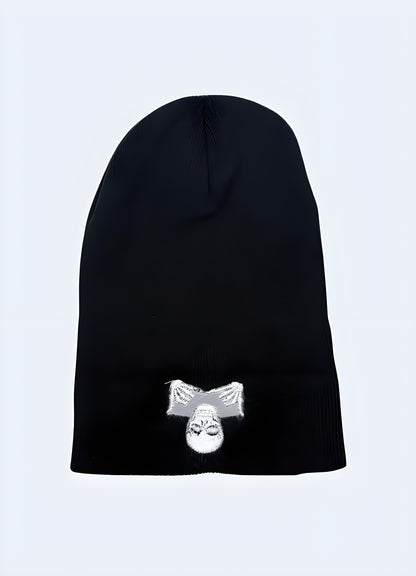 Front view of a black beanie with a skull design, showing the interior lining.