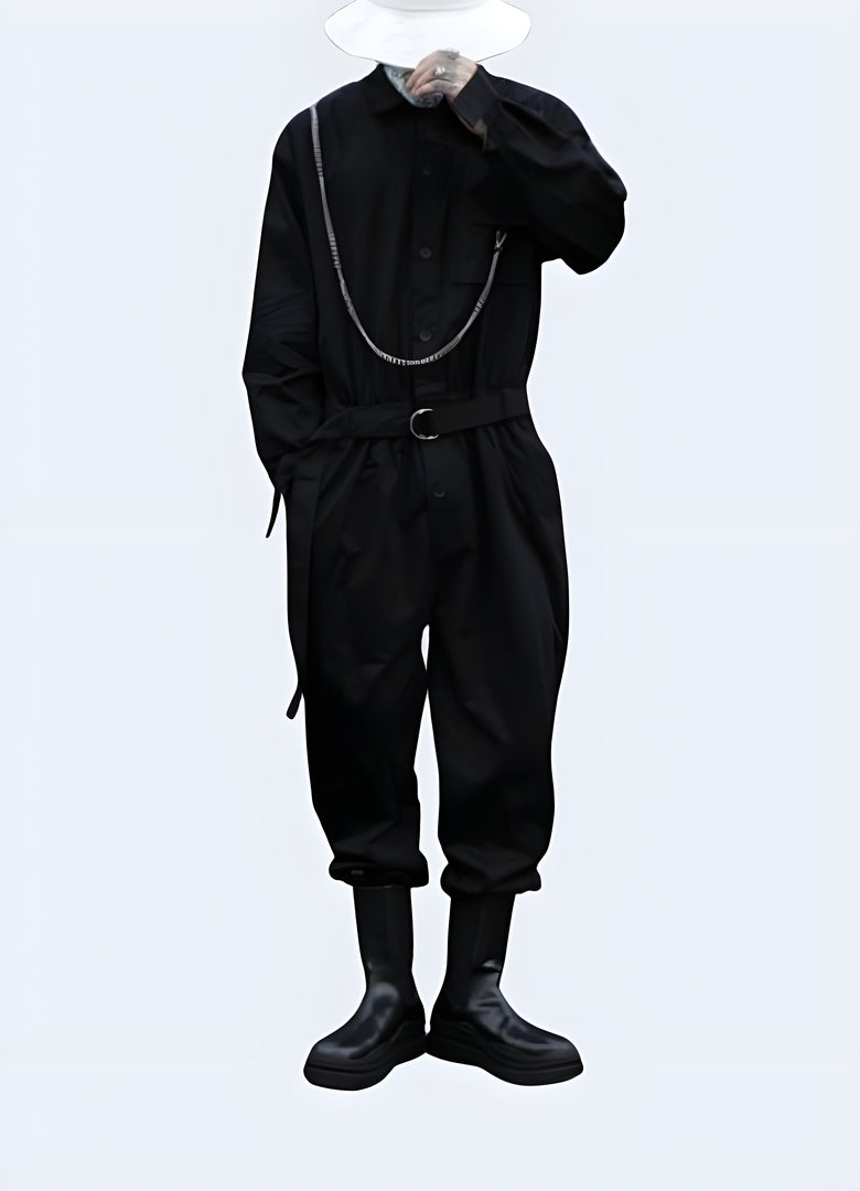 Stylish black cargo overalls with multiple pockets and straps, worn by a man in an urban Canada environment, photographed from behind.