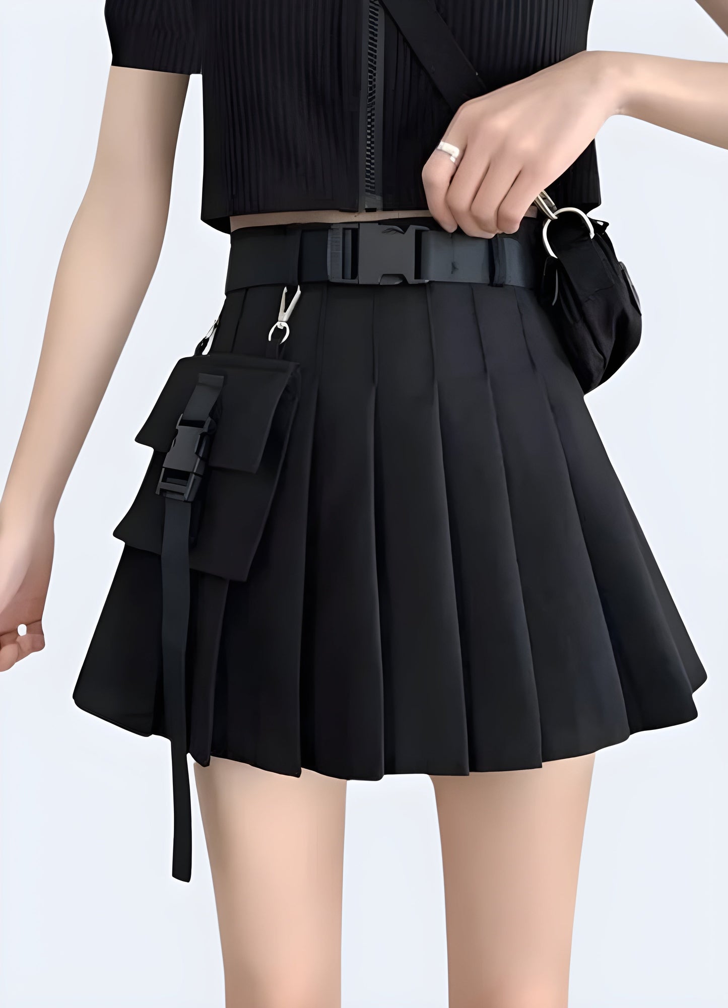 Edgy black cargo pleated mini skirt, combining style and functionality for a trendy look in the Canada urban fashion scene.