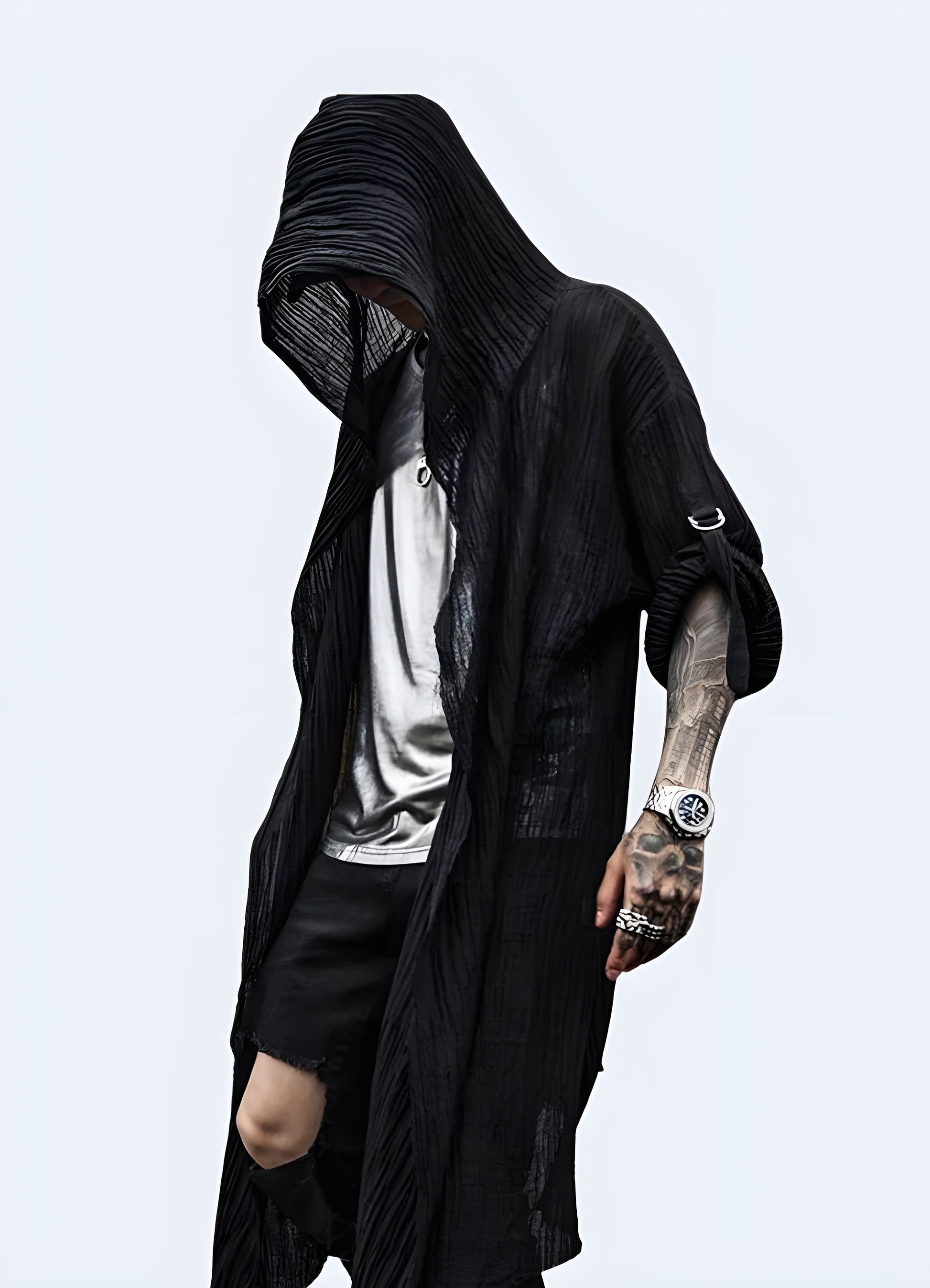 Front view of a man wearing a black cloak with a hood, showcasing its mysterious and edgy style for a bold fashion statement in the Canada.