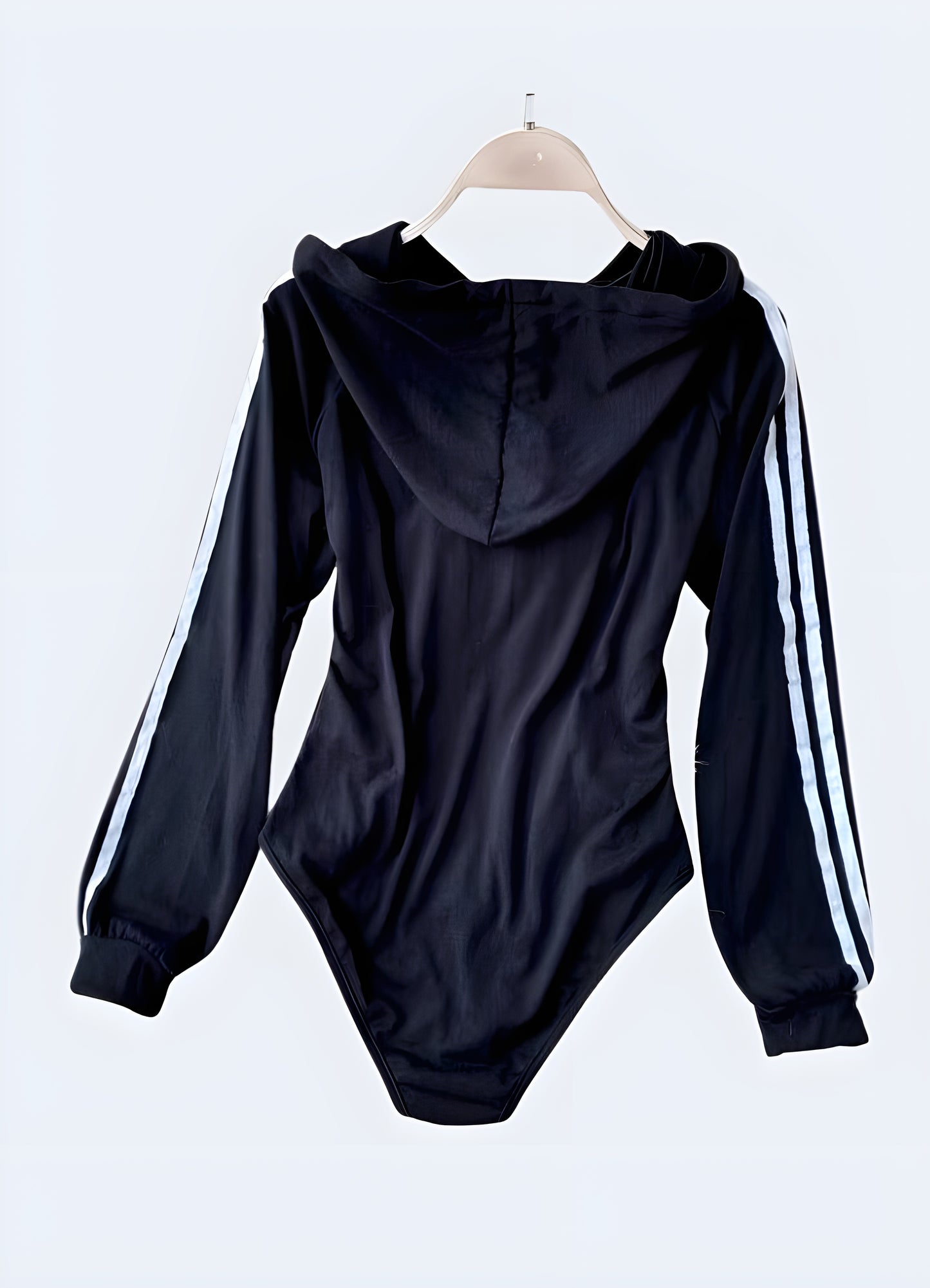 Sleek black hoodie bodysuit with a modern design, perfect for Canada fashion enthusiasts seeking comfortable and stylish urban wear.